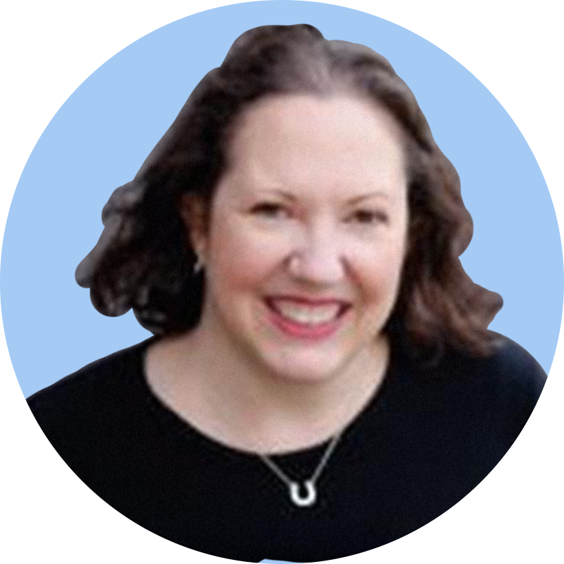 A smiling woman with shoulder-length brown hair, wearing a black top and a silver necklace, against a blue background.
