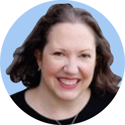 A woman with brown hair smiling against a light blue background.