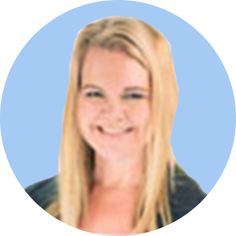 Smiling blonde woman with long hair and glasses, wearing a dark top, against a blue background.