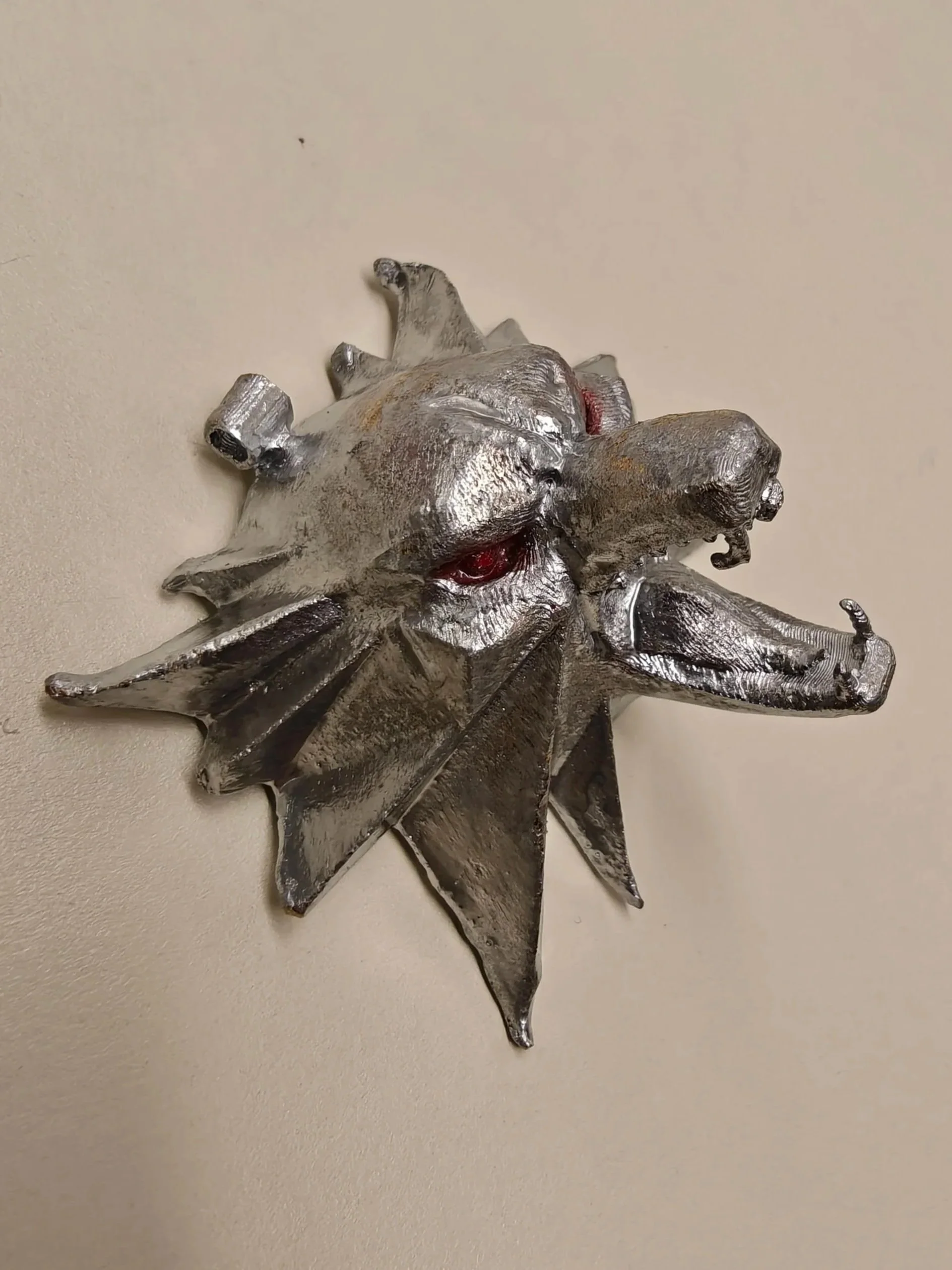 Painted bronze casting from 3D print of the School of the Wolf medallion from the "Witcher", 2.1' x 2.3', 2025