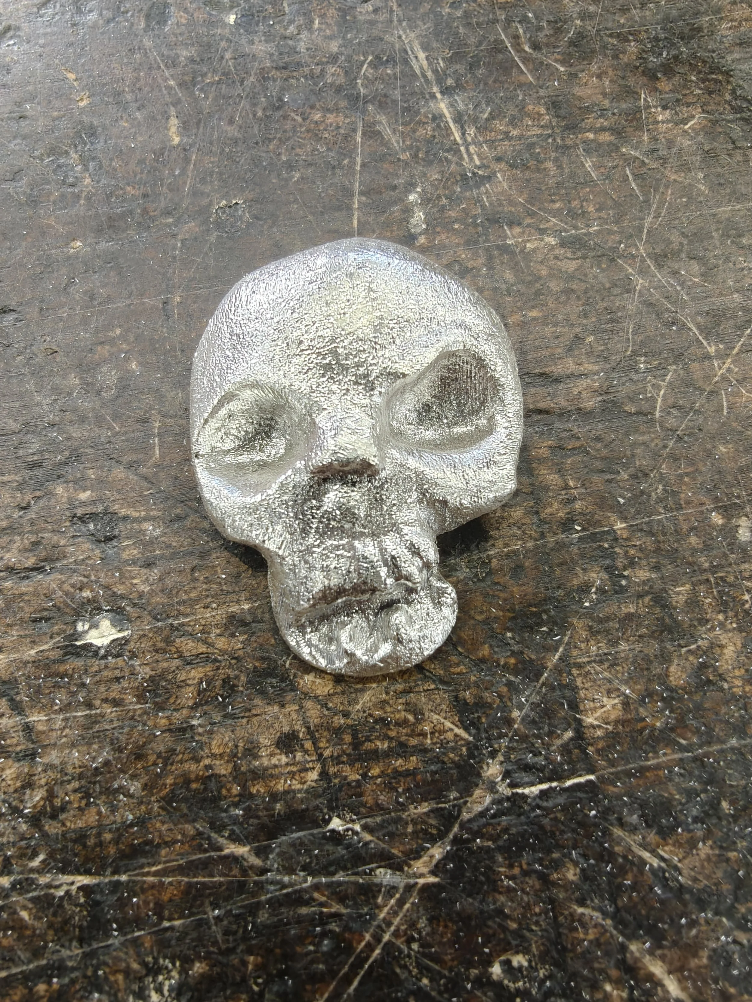 Sterling silver casting of 3D printed skull, 1.25' x 1.5', 2025