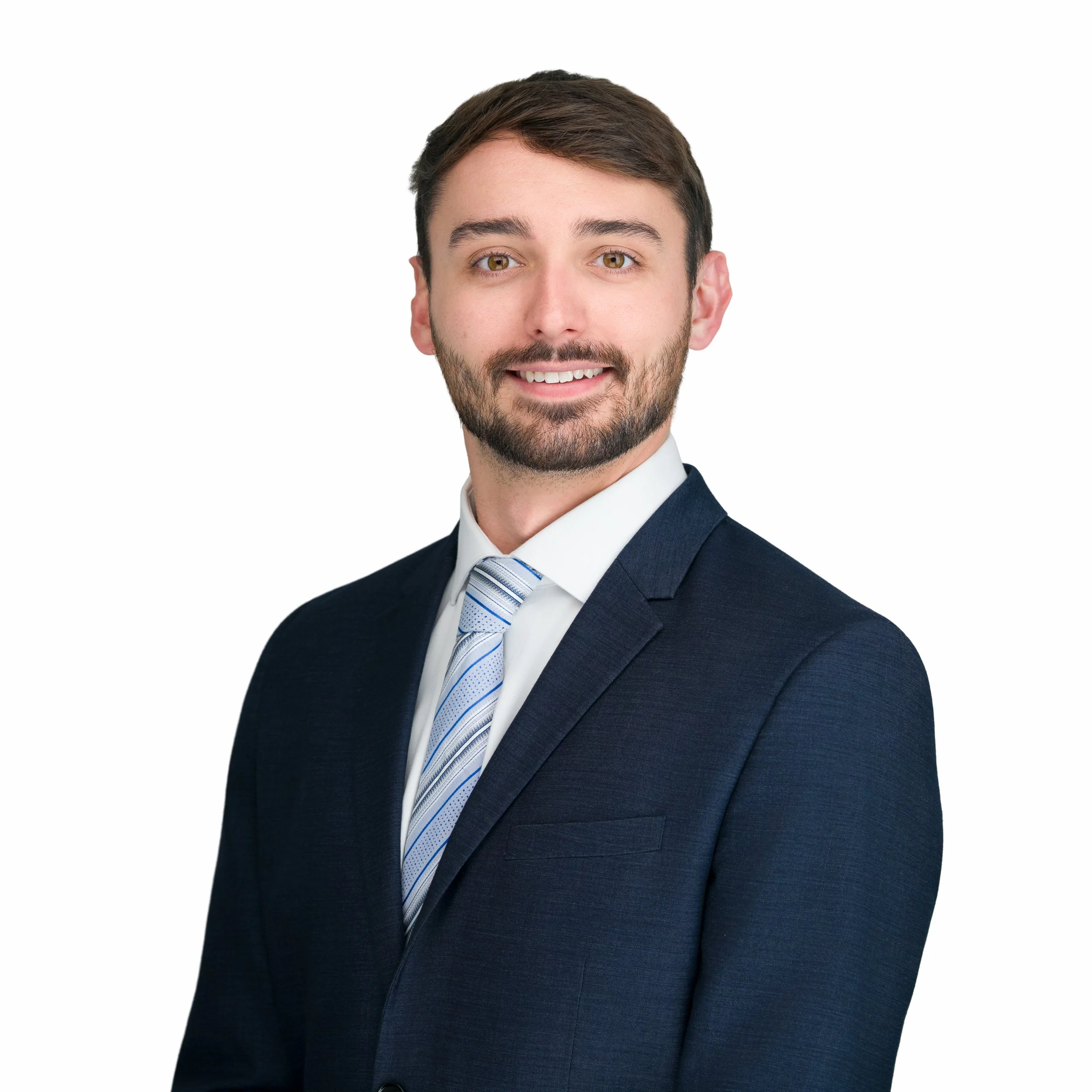 Image of Brendon Donoghue in a navy suite and blue striped tie.