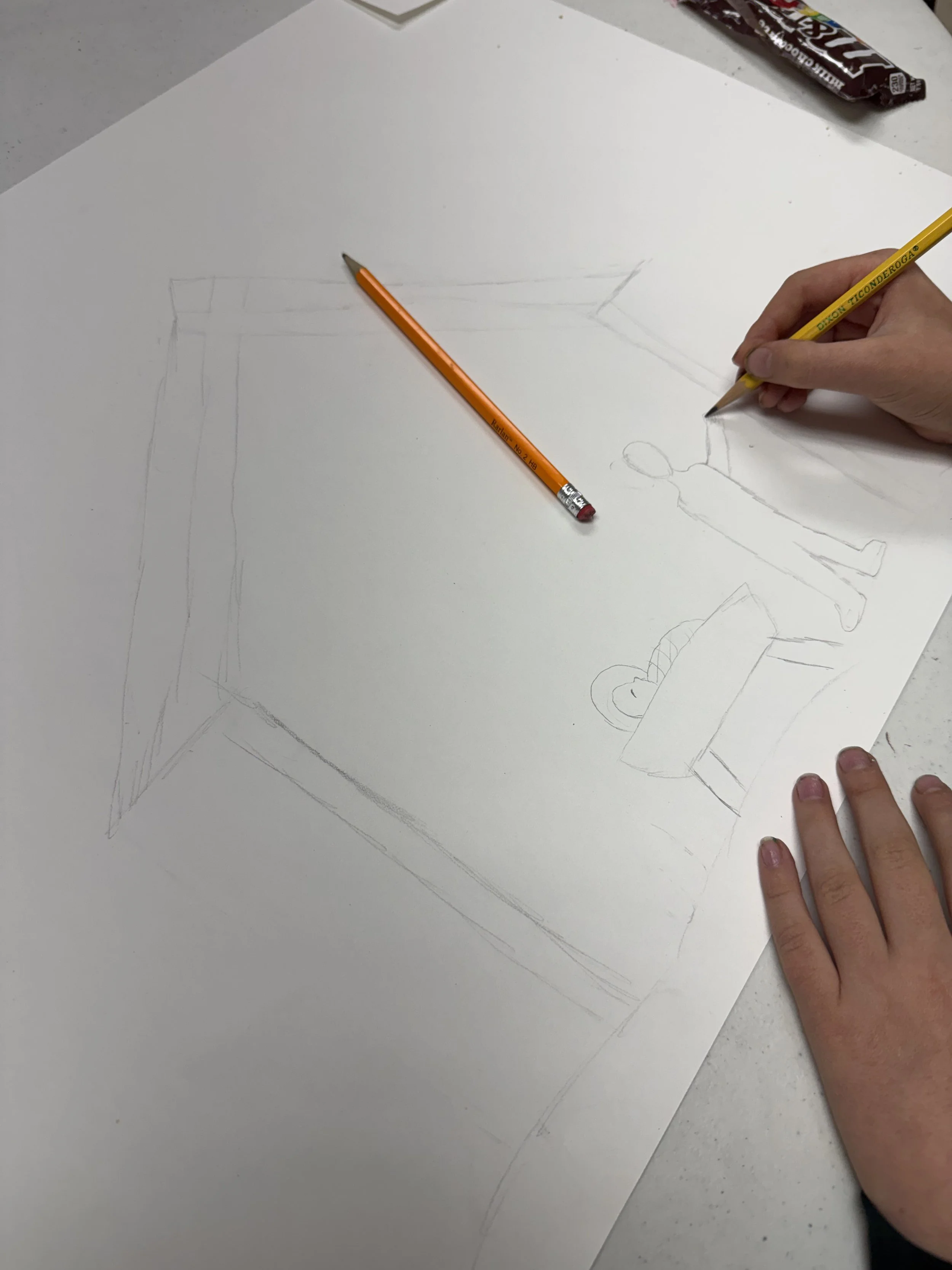 Person drawing a picture on large white paper with a pencil, with a partially shaded sketch of a person standing near a table. Pencil and eraser materials are nearby.