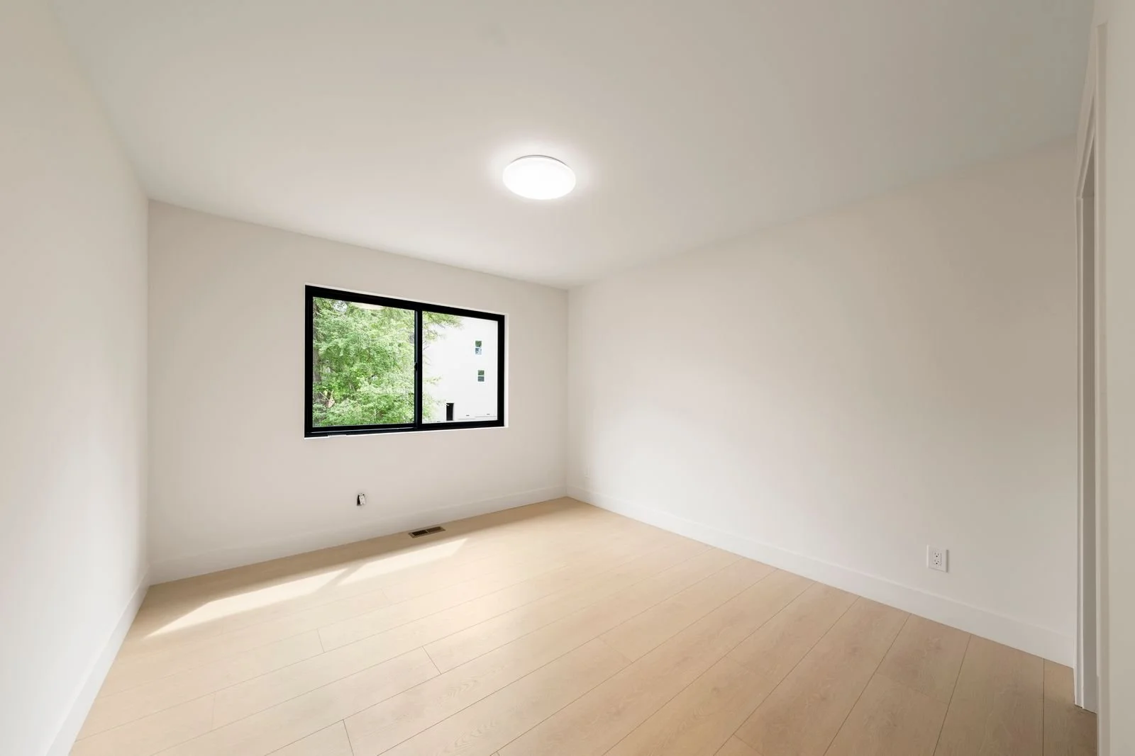 bedroom one with lots of natural light