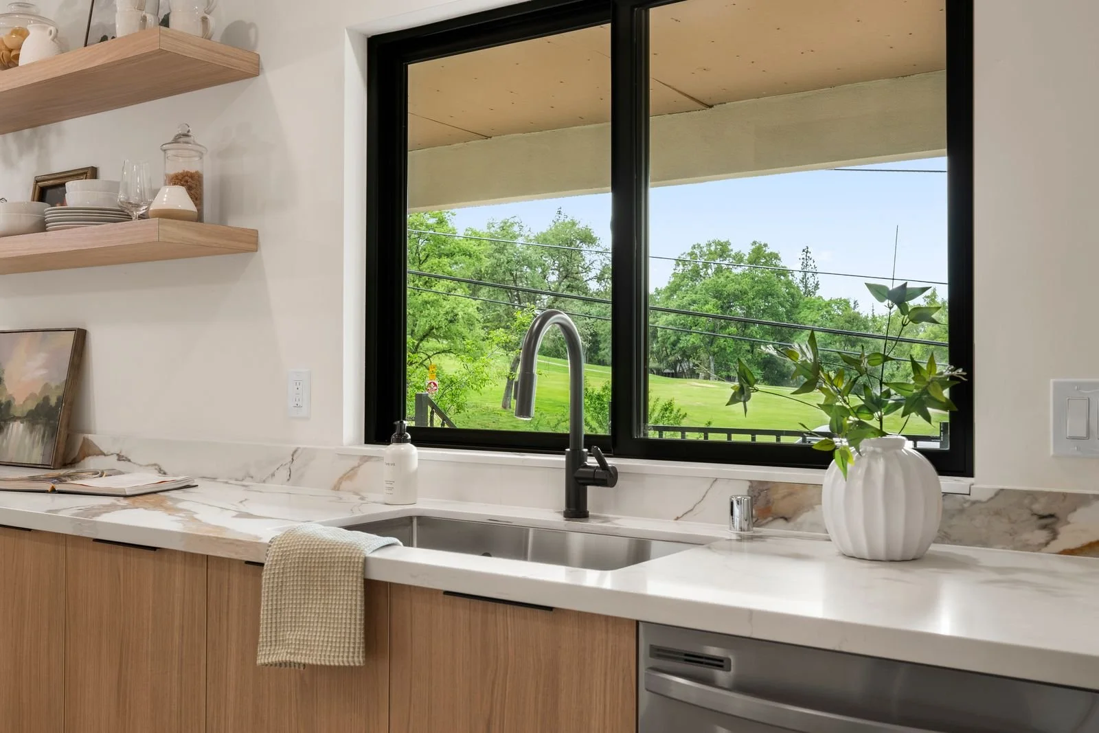 Have fun watching the golfers while washing the dishes