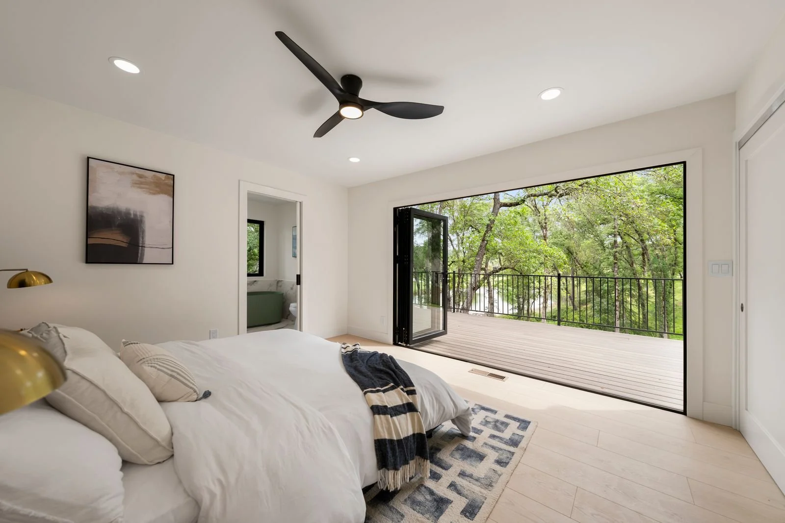 master bedroom with doors that open to the back deck!