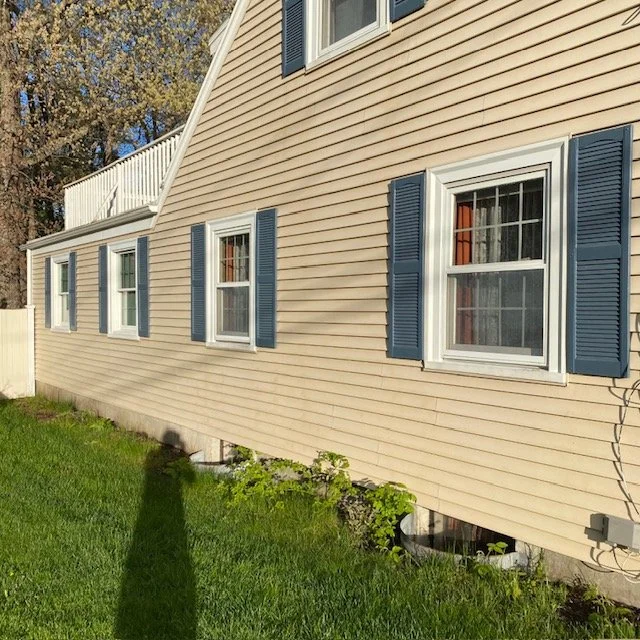 After: Vinyl siding after soft washing in Weymouth, MA — mildew removed and surface fully restored to clean condition.