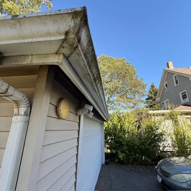Before: Gutter in Quincy, MA with heavy dirt and buildup.
