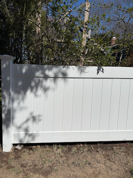 After: Vinyl fence after professional pressure washing in Randolf, MA, with dirt and algae removed for a cleaner, brighter appearance.