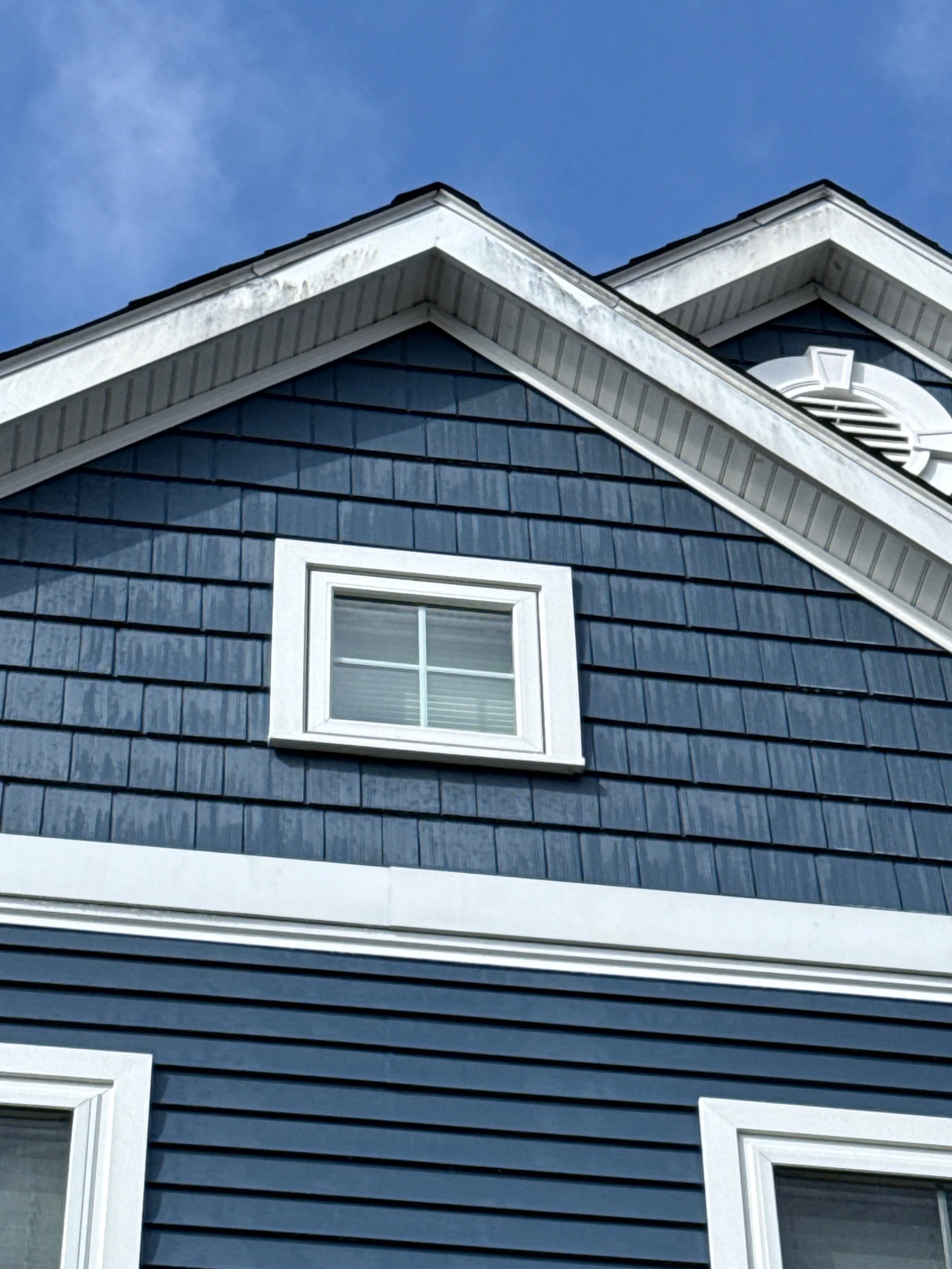 Before: Milton, MA house before soft washing with dirt and algae build up on siding and trim.