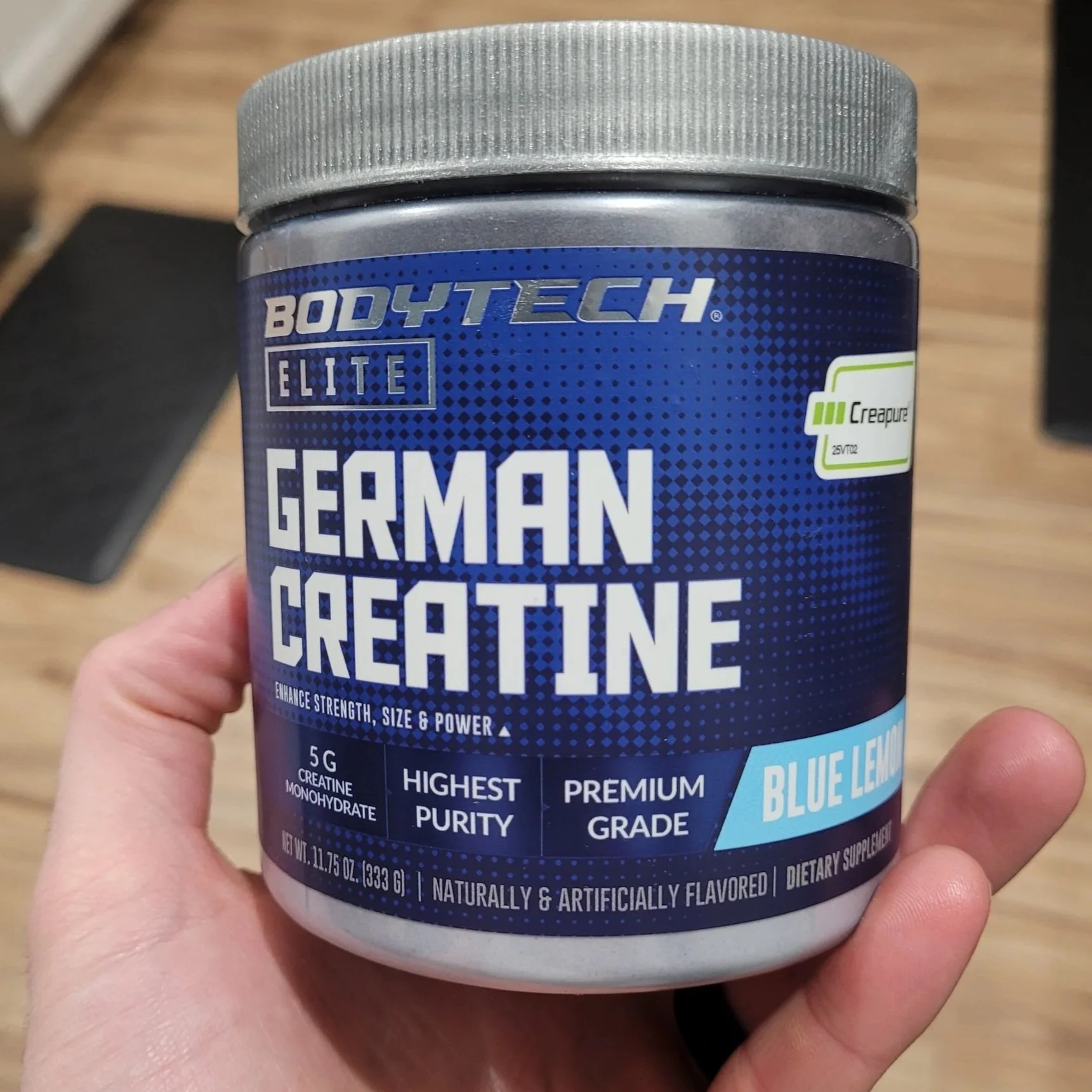 Container of BodyTech Elite German Creatine supplement in Blue Lemon flavor.