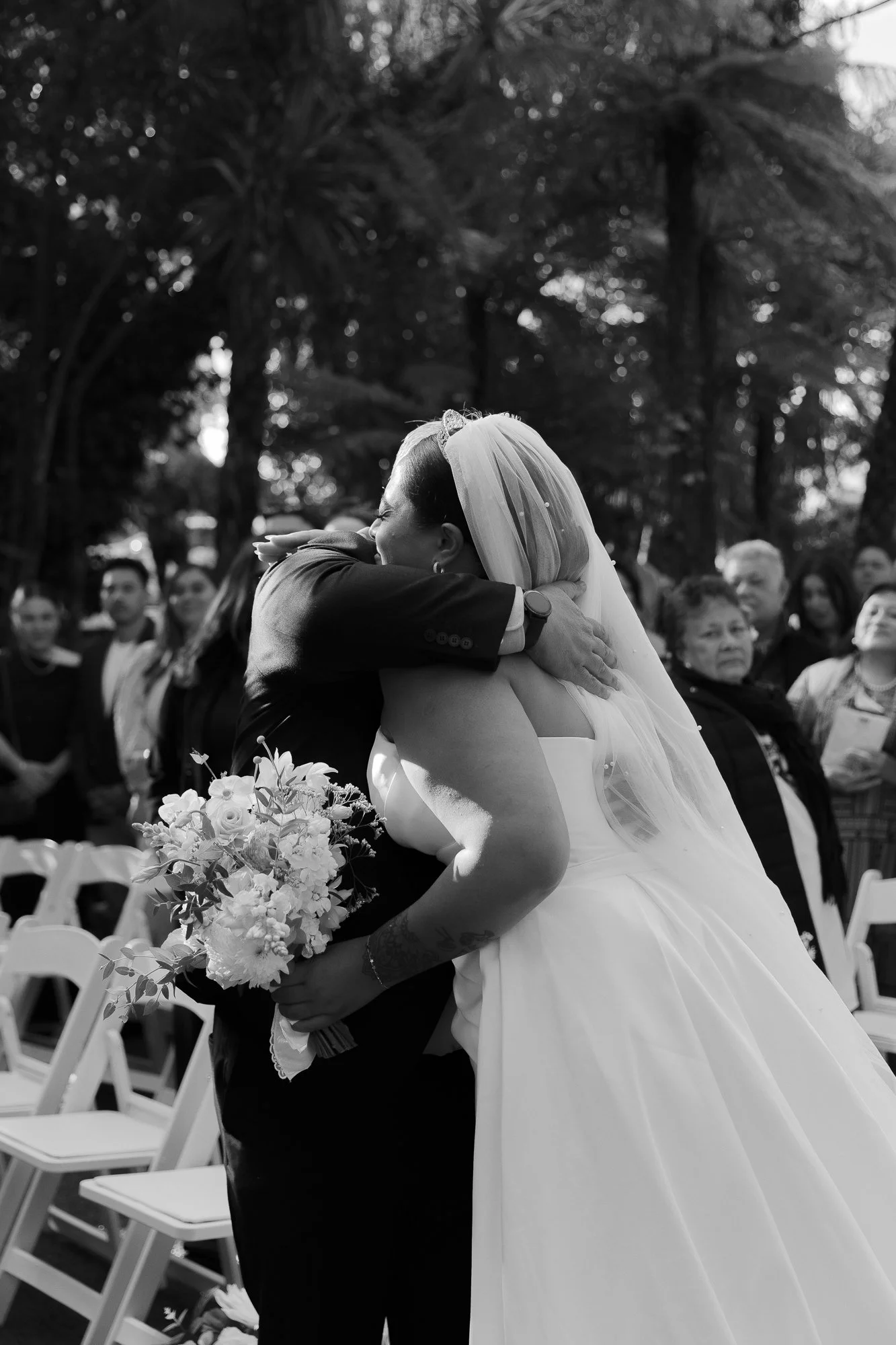 Bride embracing a wedding guest
