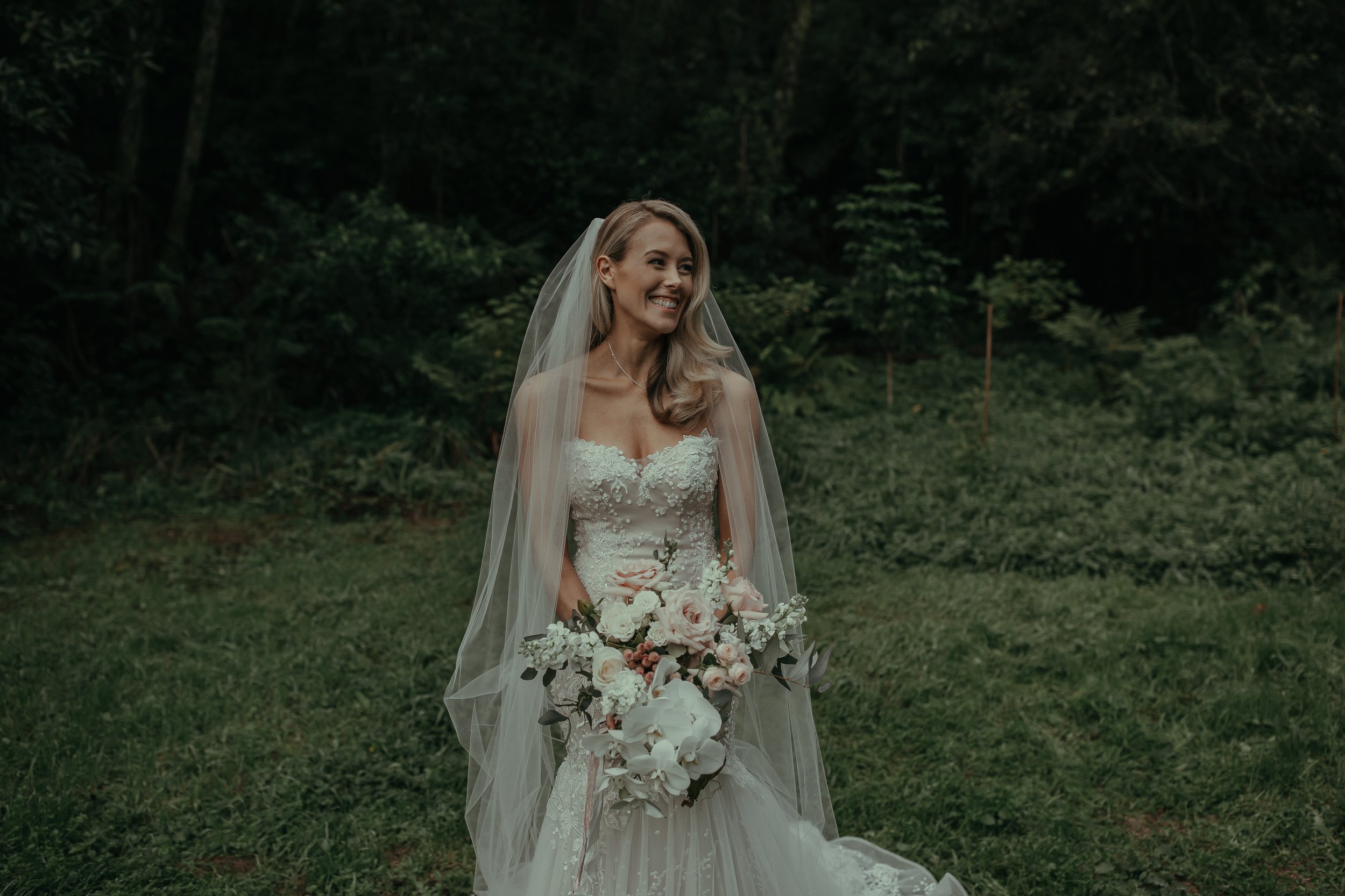 D'Arne smiling in the forrest