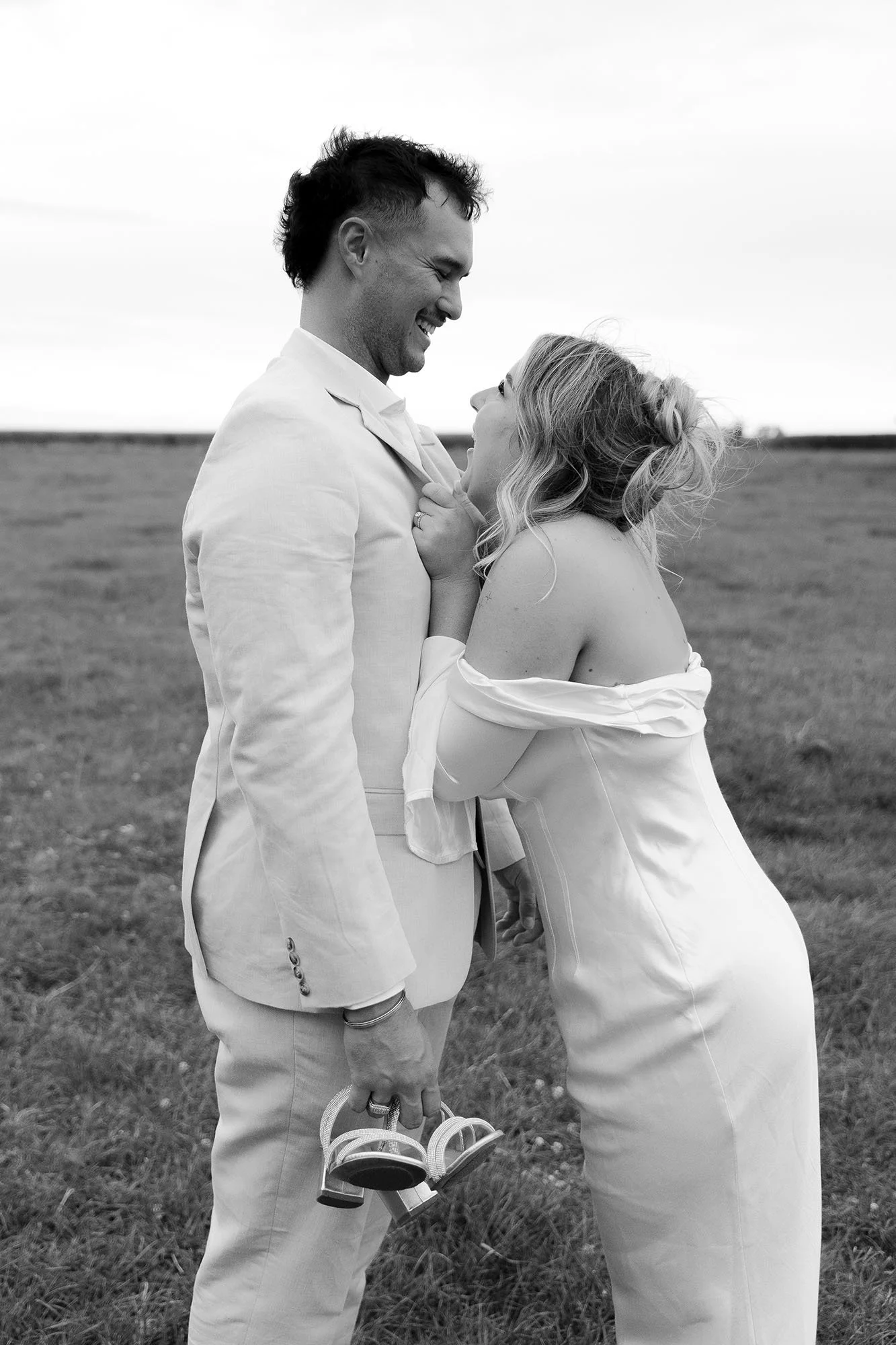 Bride and groom laughing together