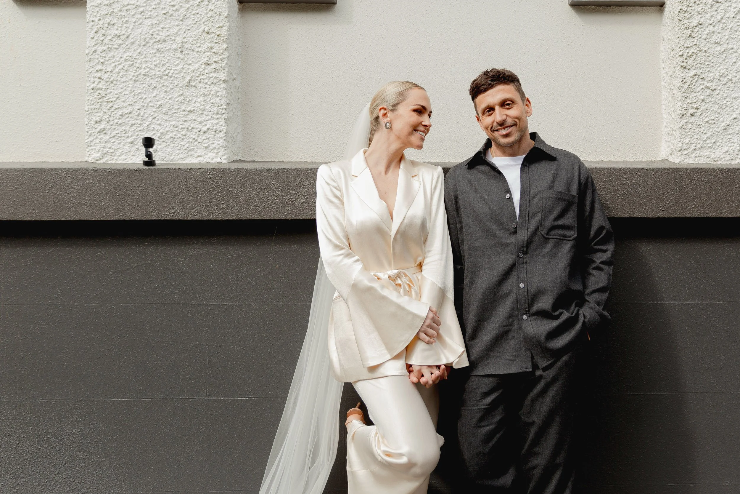 Bride and groom smiling at The convent