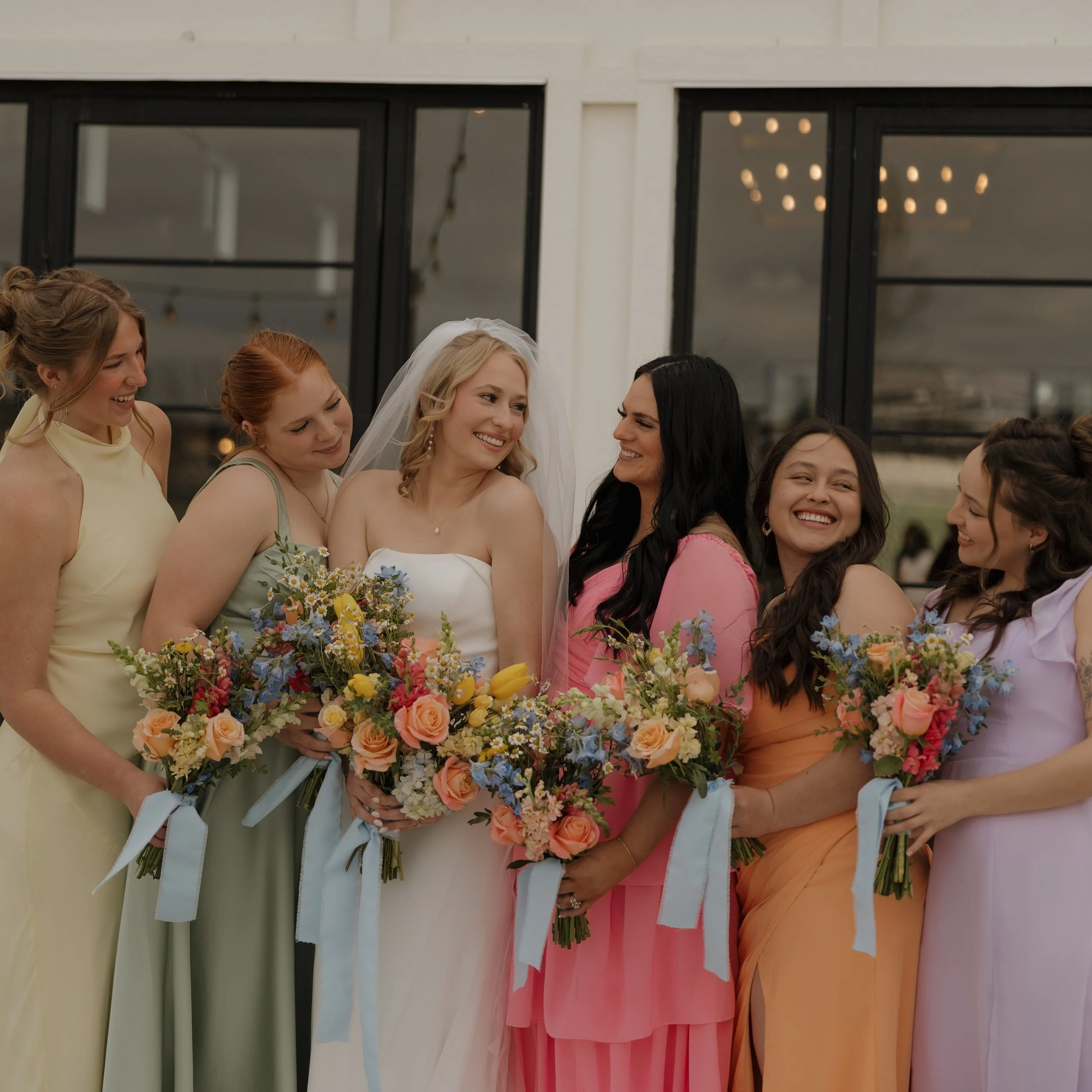 Beautiful fresh pastel bouquet arrangements for Cassie and her best girls ❤ Tying it all together with a dusty blue ribbon. Love it ❤

Flowers: @dreamday.eventrentals 
Venue: @wild_acres_barn 
Photo: @reaganjohnphotography