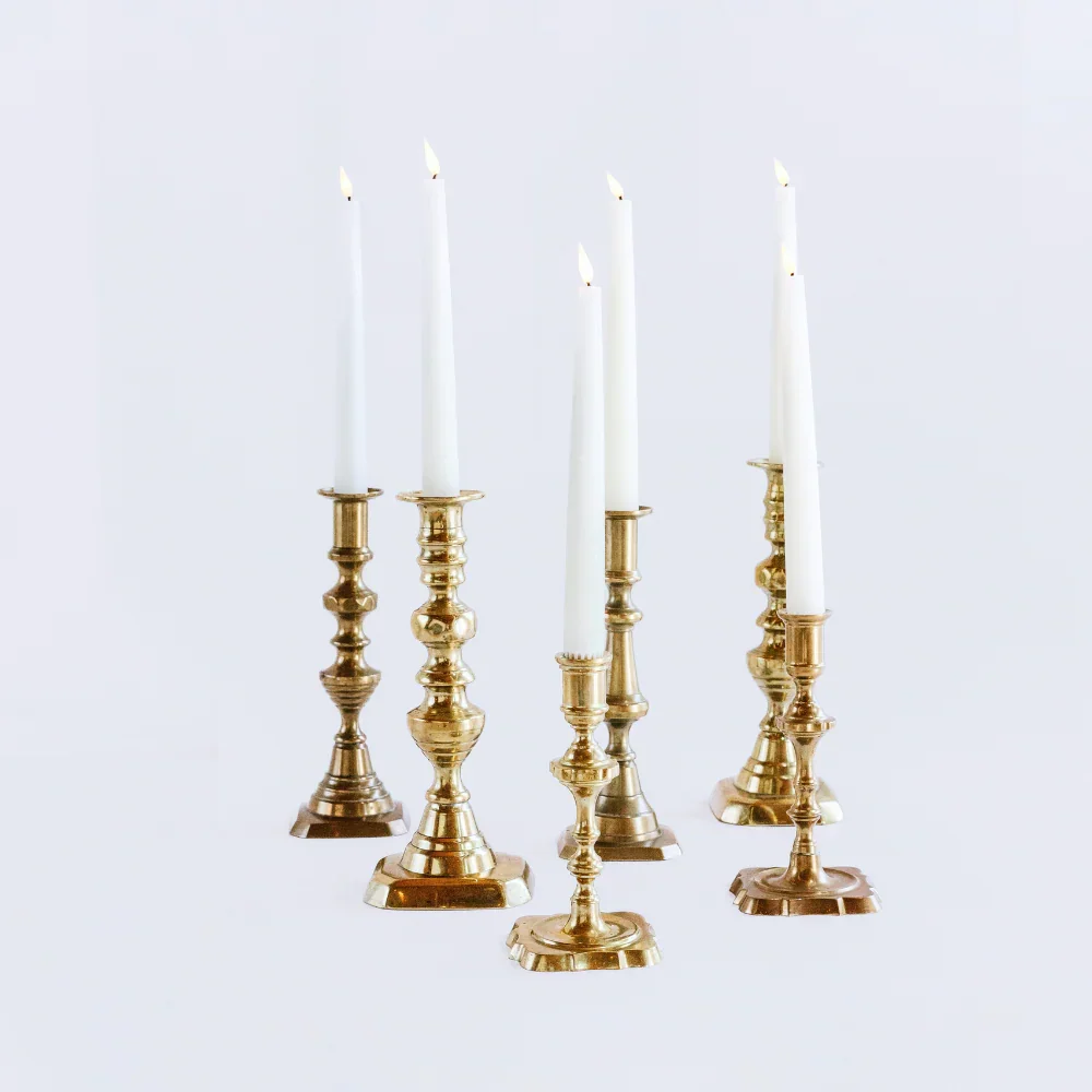 lit_brass_candlestick_rentals_1_1000x1000.webp