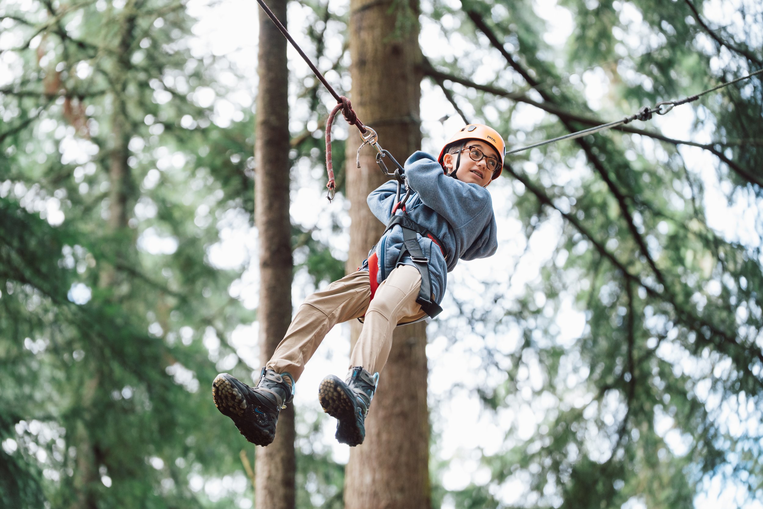 The moments before flight: a youth stranded mid-air, looking out to parents & freinds. 
