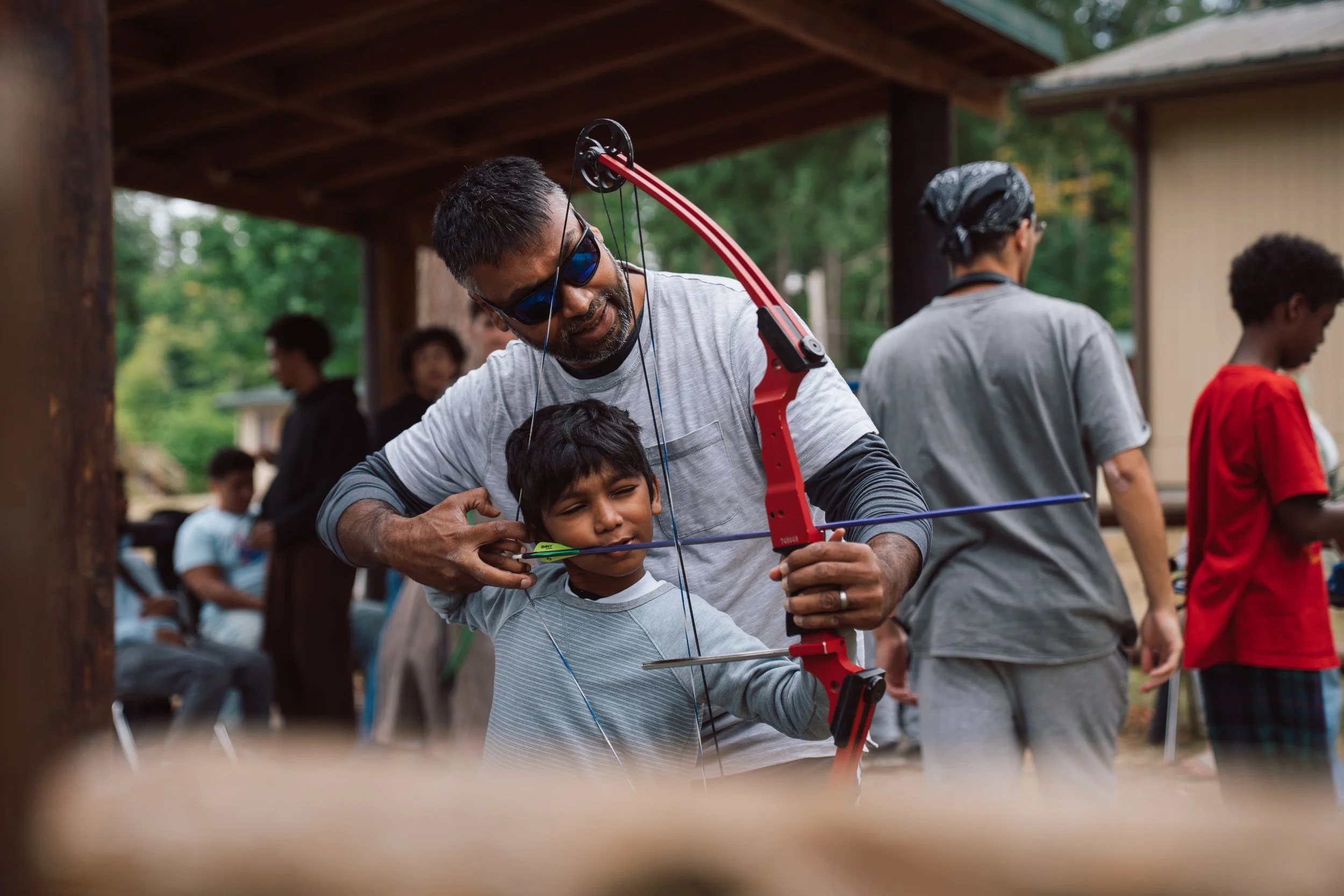 A father and son sharing a invaluable moment at Camp Manara near Mount Rainer.
