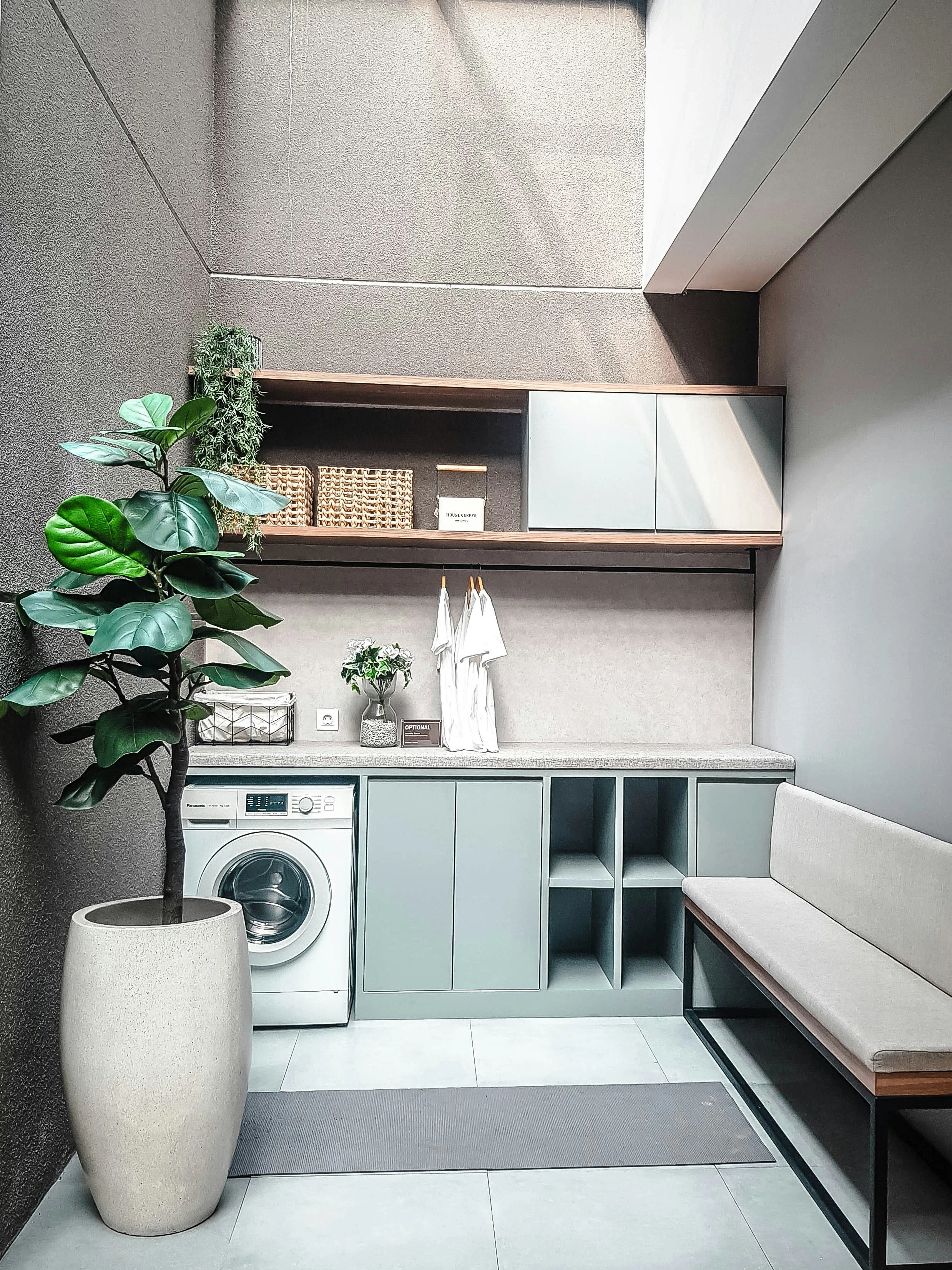 Modern residential laundry room with waterproofed floor and wall membrane, Auckland