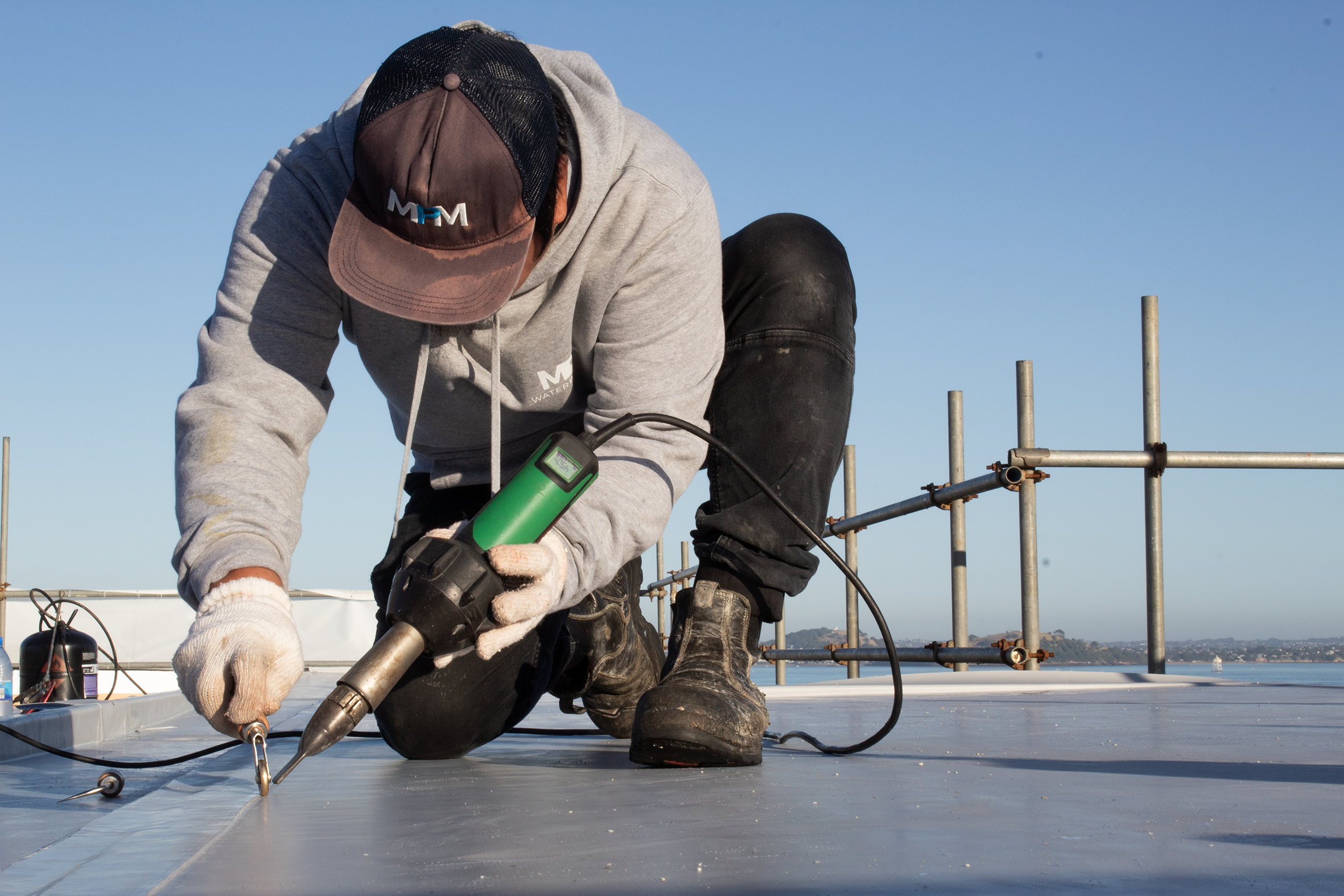 MPM Waterproofing certified applicator installing membrane podium system on rooftop, Auckland