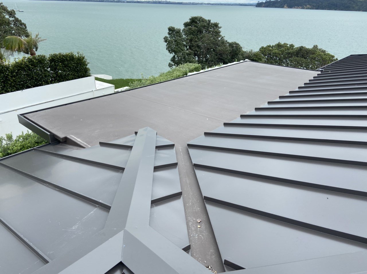 Viking TPO membrane roofing on new residential build overlooking Herne Bay Auckland