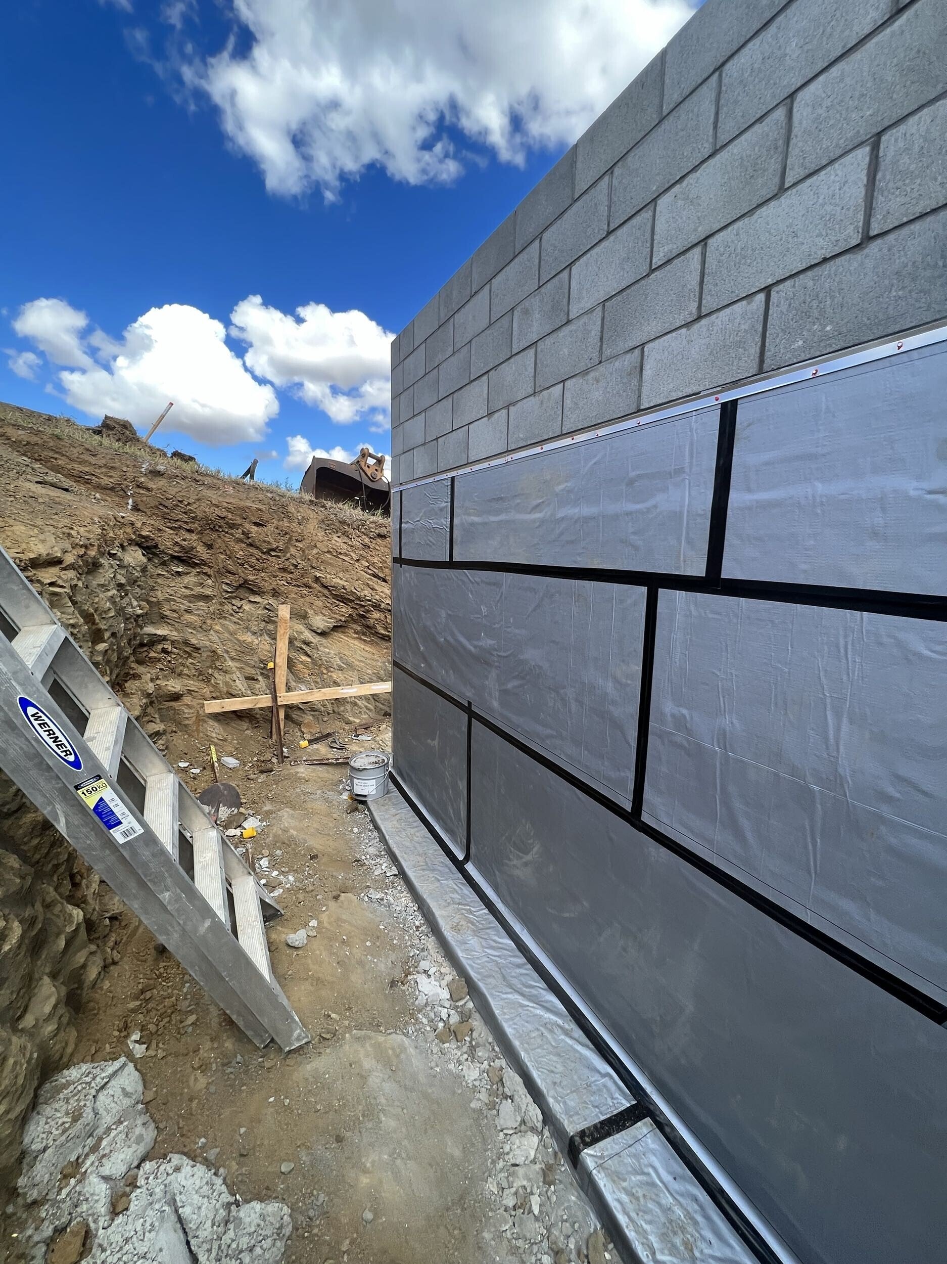 MPM Waterproofing below-ground tanking membrane installed on retaining wall, Auckland residential project