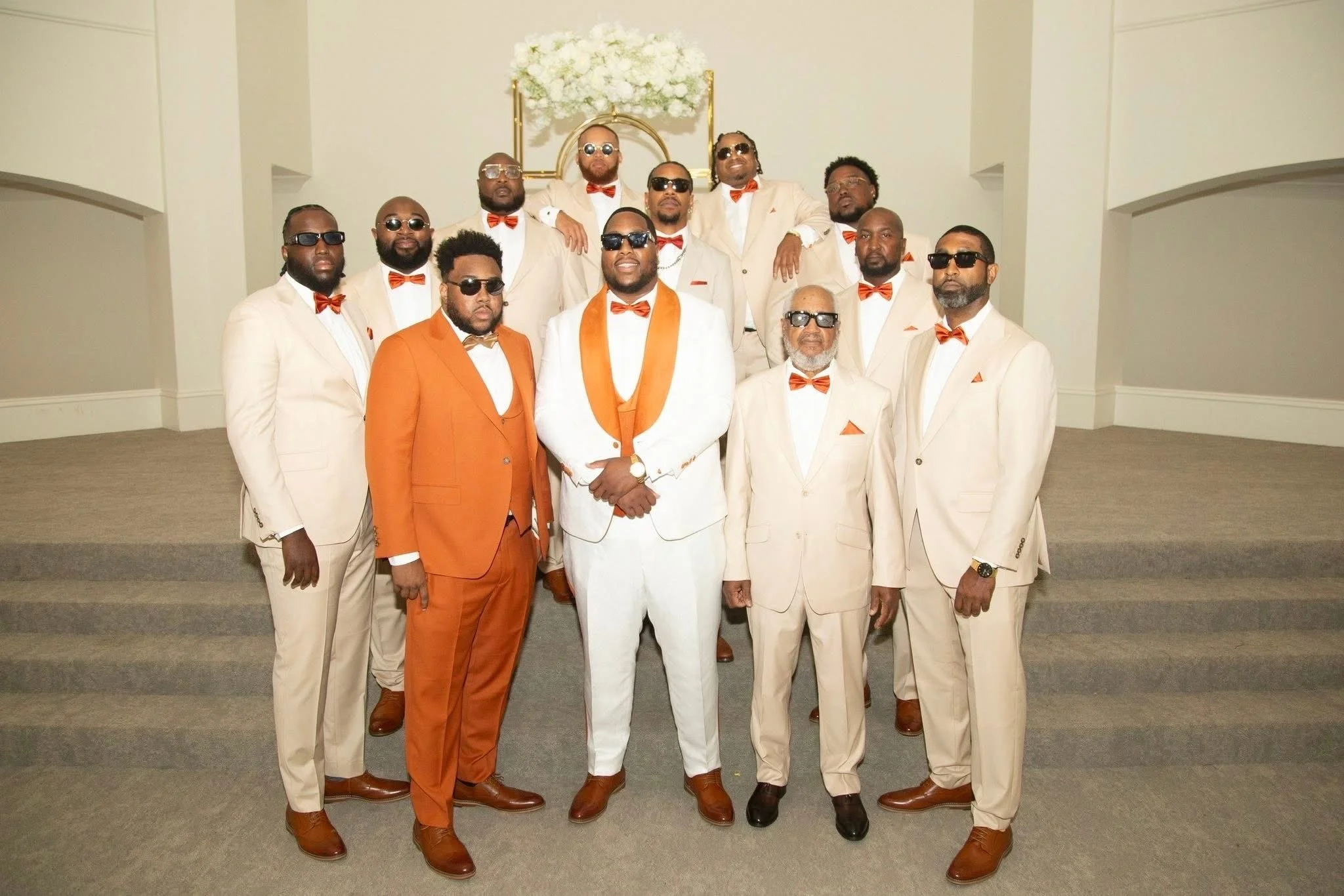 Group of men dressed in formal suits. 