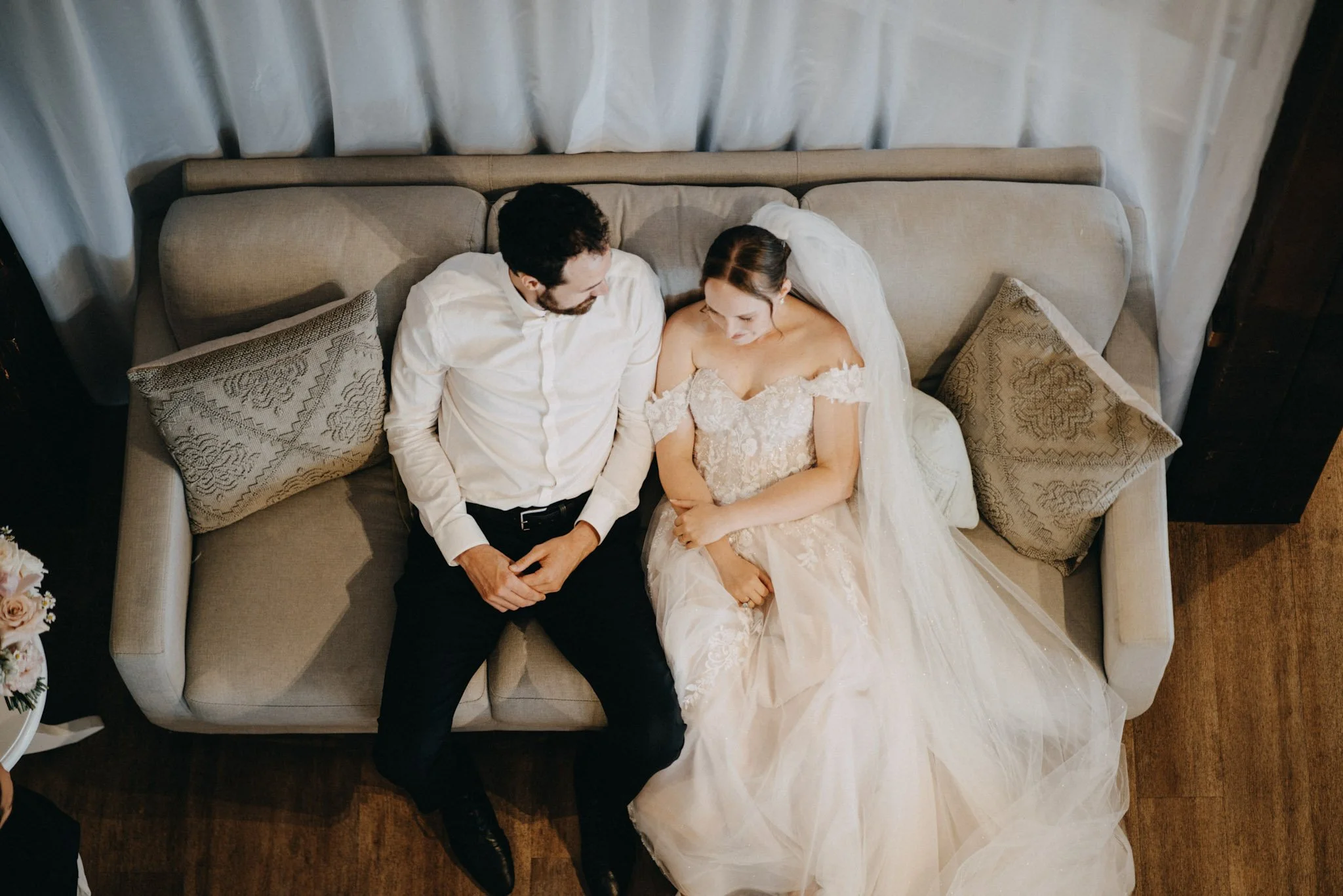 Romantic bride and groom portrait on sofa on Sunshine Coast
