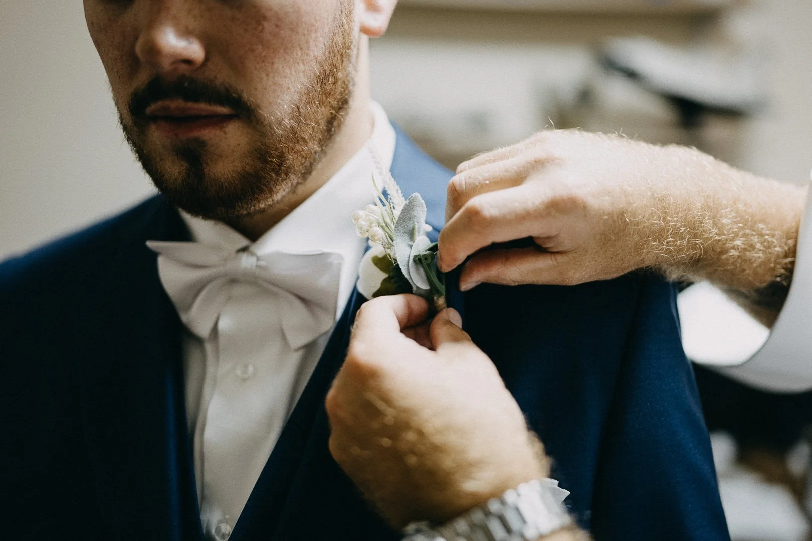 Father of groom adjusts boutonnière at country wedding in Brisbane