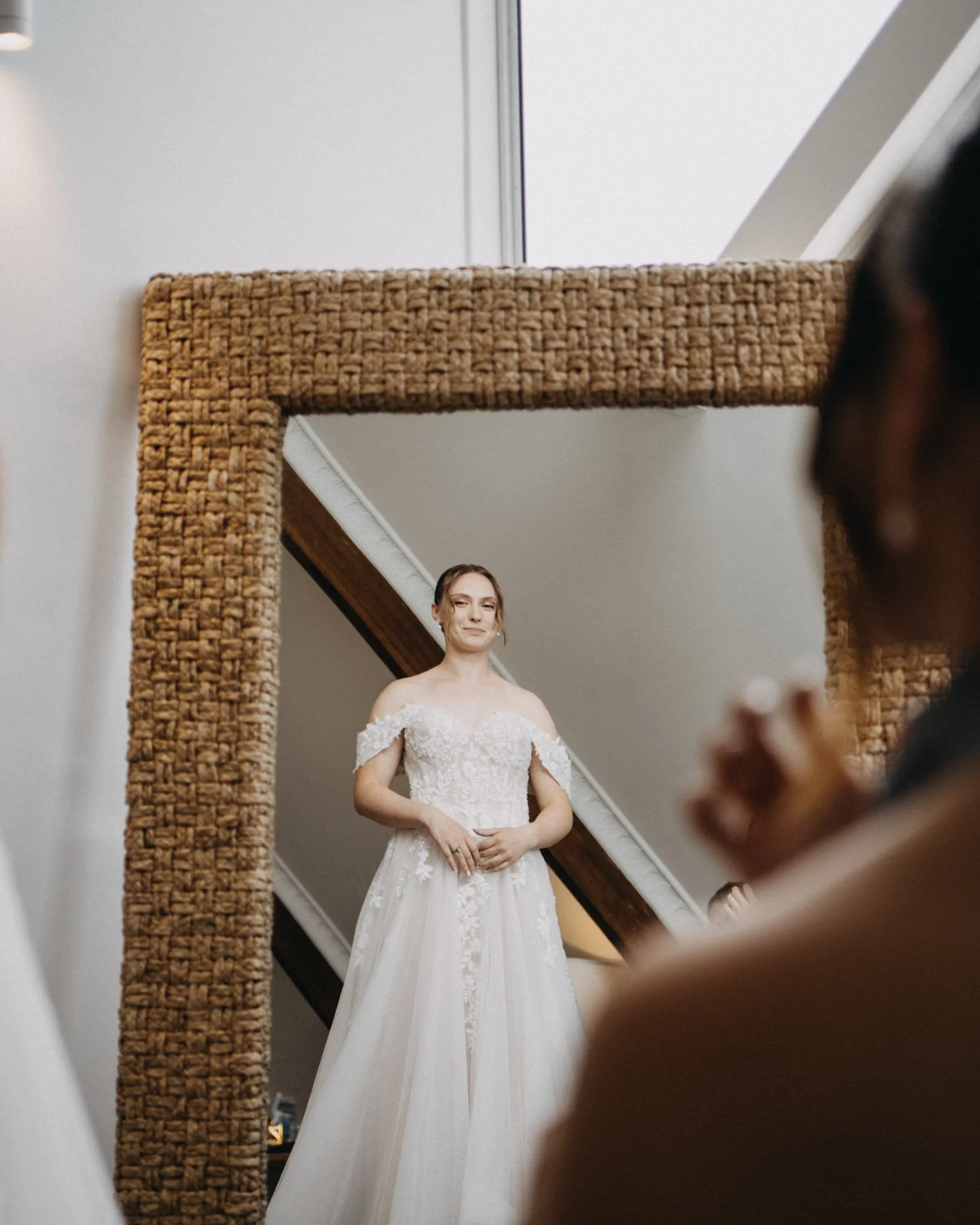 Bride looks in mirror during bridal prep at Maleny hinterland wedding venue