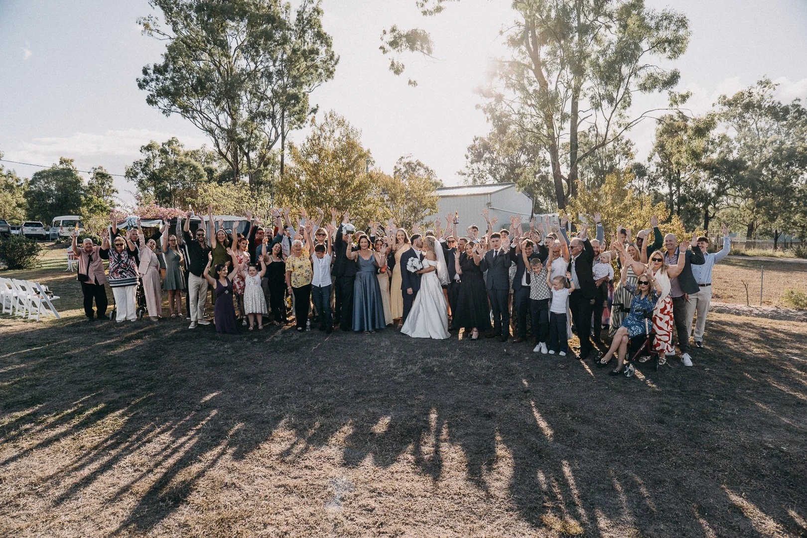 Wedding party pose for group photo at country wedding in Laidley