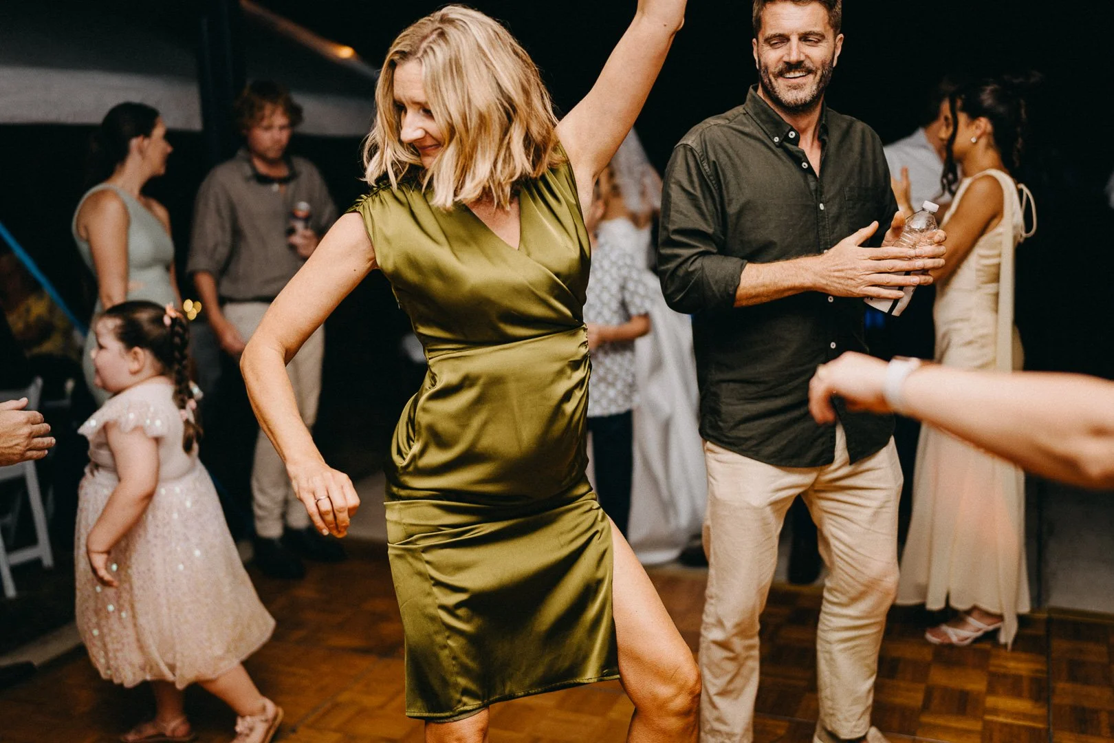 Candid shot of wedding party dancing at Brisbane wedding on acreage.