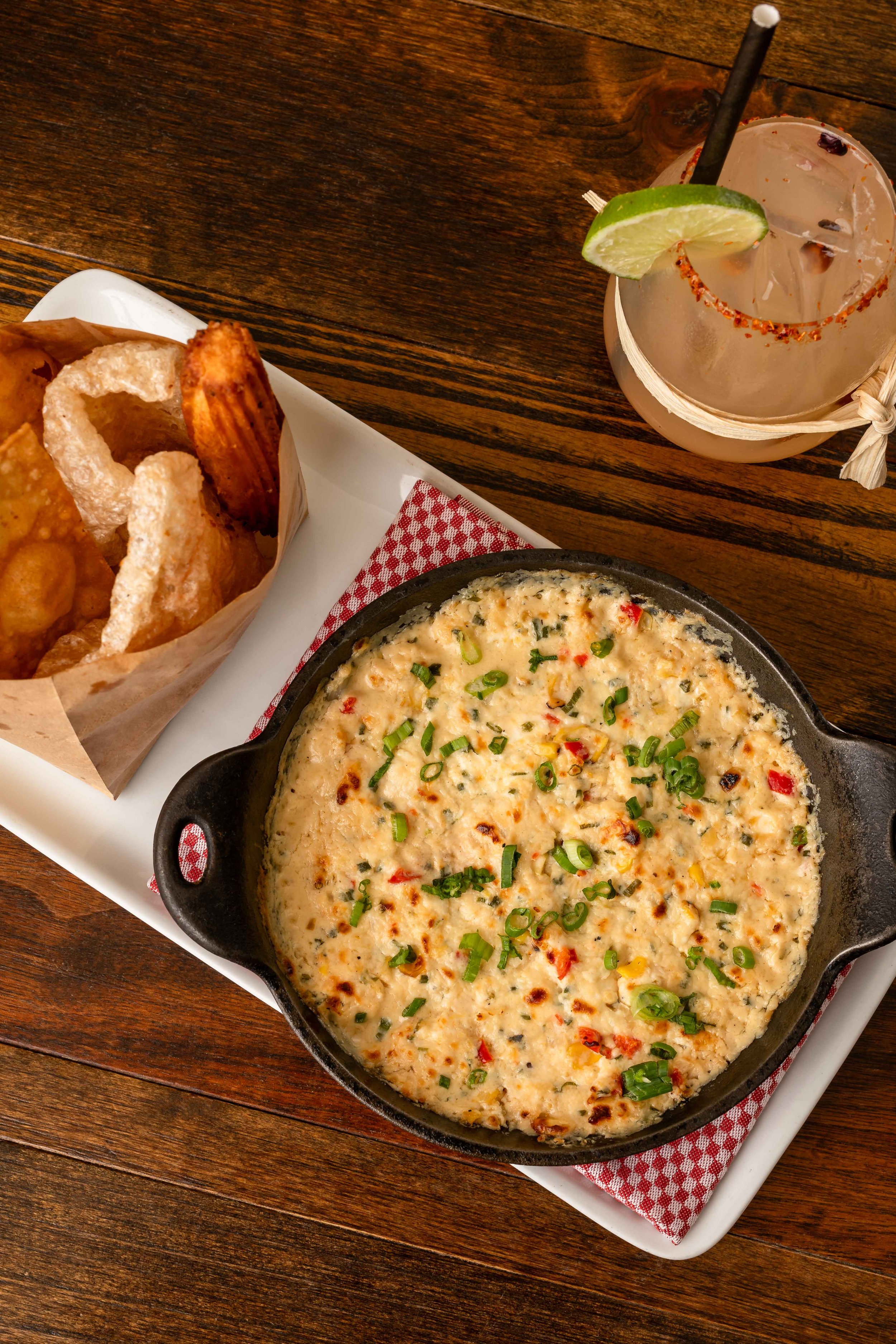 Southwest corn queso with savory churros and chips.