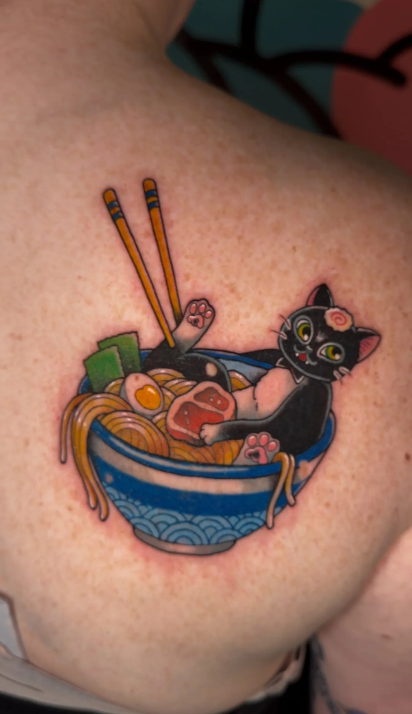 Cat inside a ramen bowl