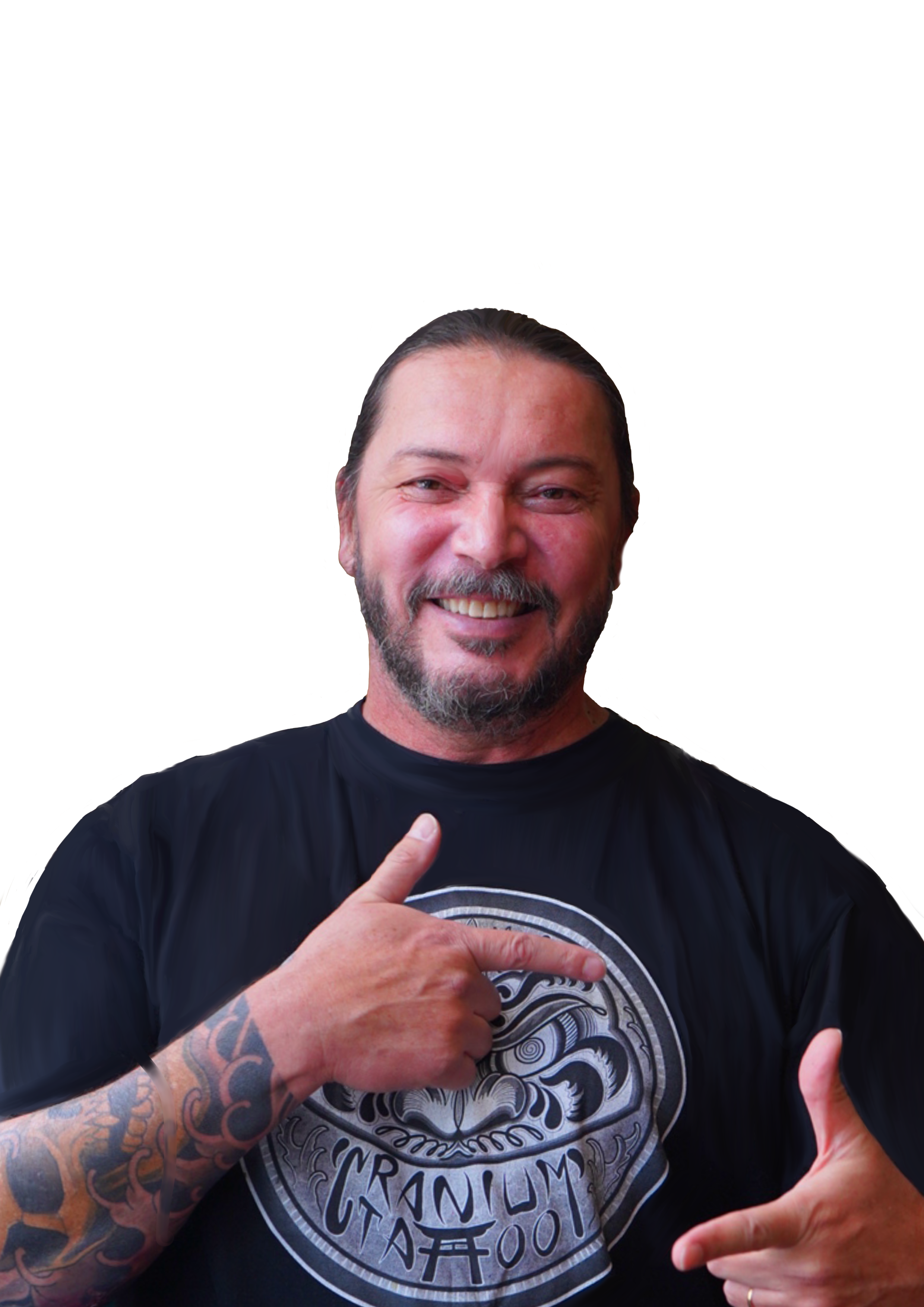 A smiling man with a beard and tattoos on his arm, wearing a black T-shirt with a circular graphic, making hand gestures.