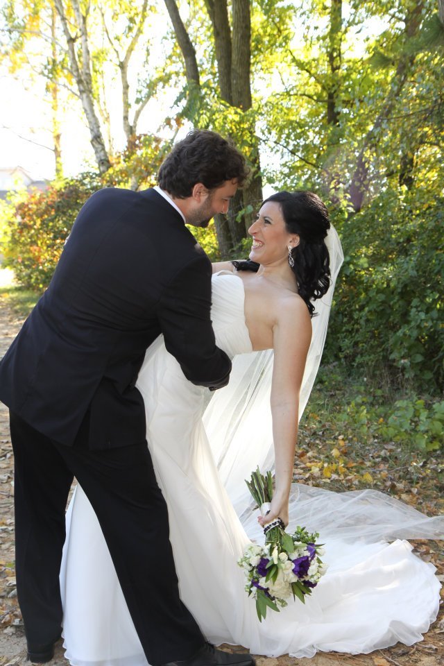 Laurie’s customers, Evan and Kade, running down a mountain after getting married. 