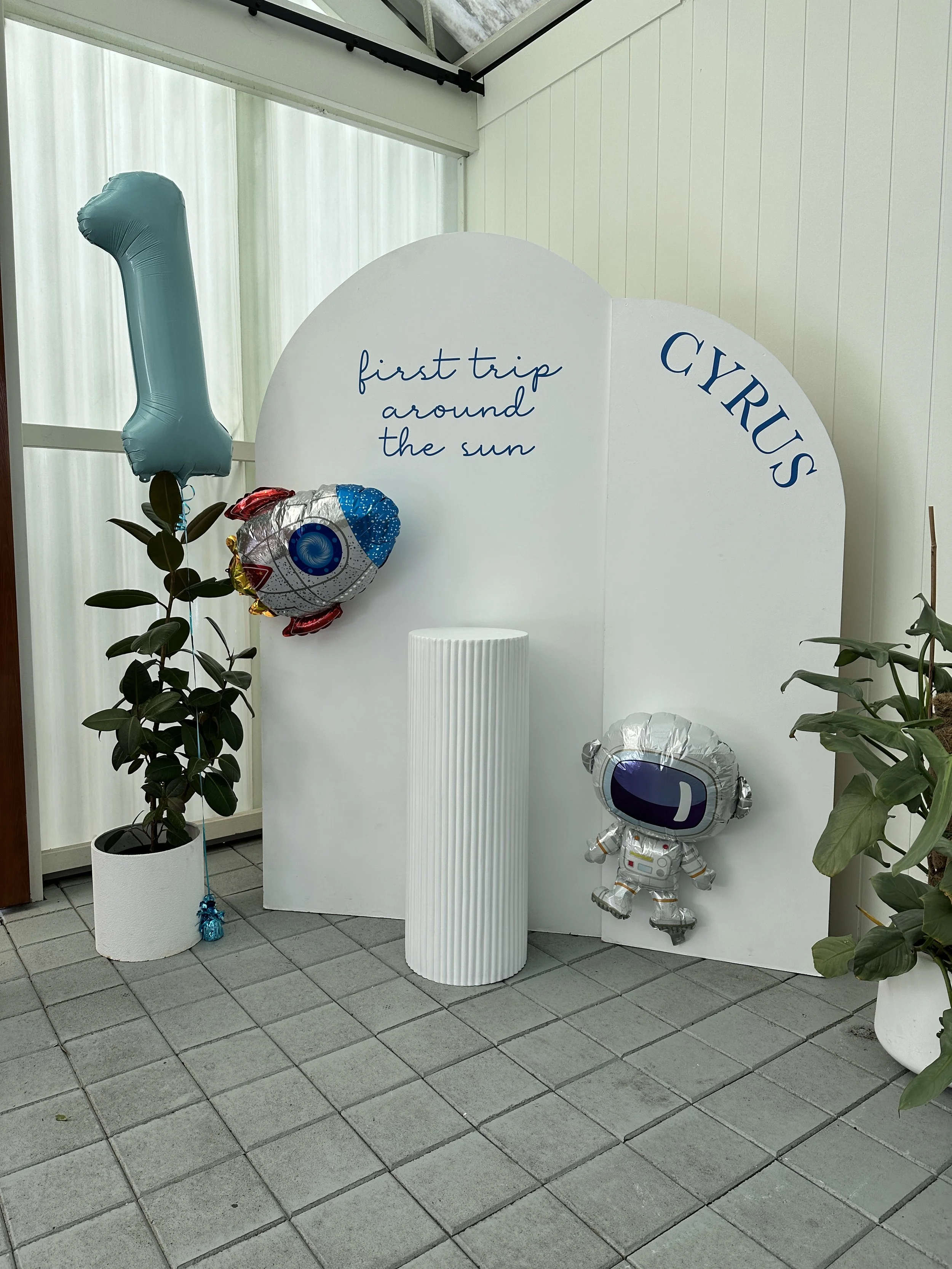 Arched Backdrops at Sublime Social, Clarence Park. Decals reading 'first trip around the sun' & 'Cyrus' in blue by Nutmeg Creative. Sublime Café & Catering, Adelaide.