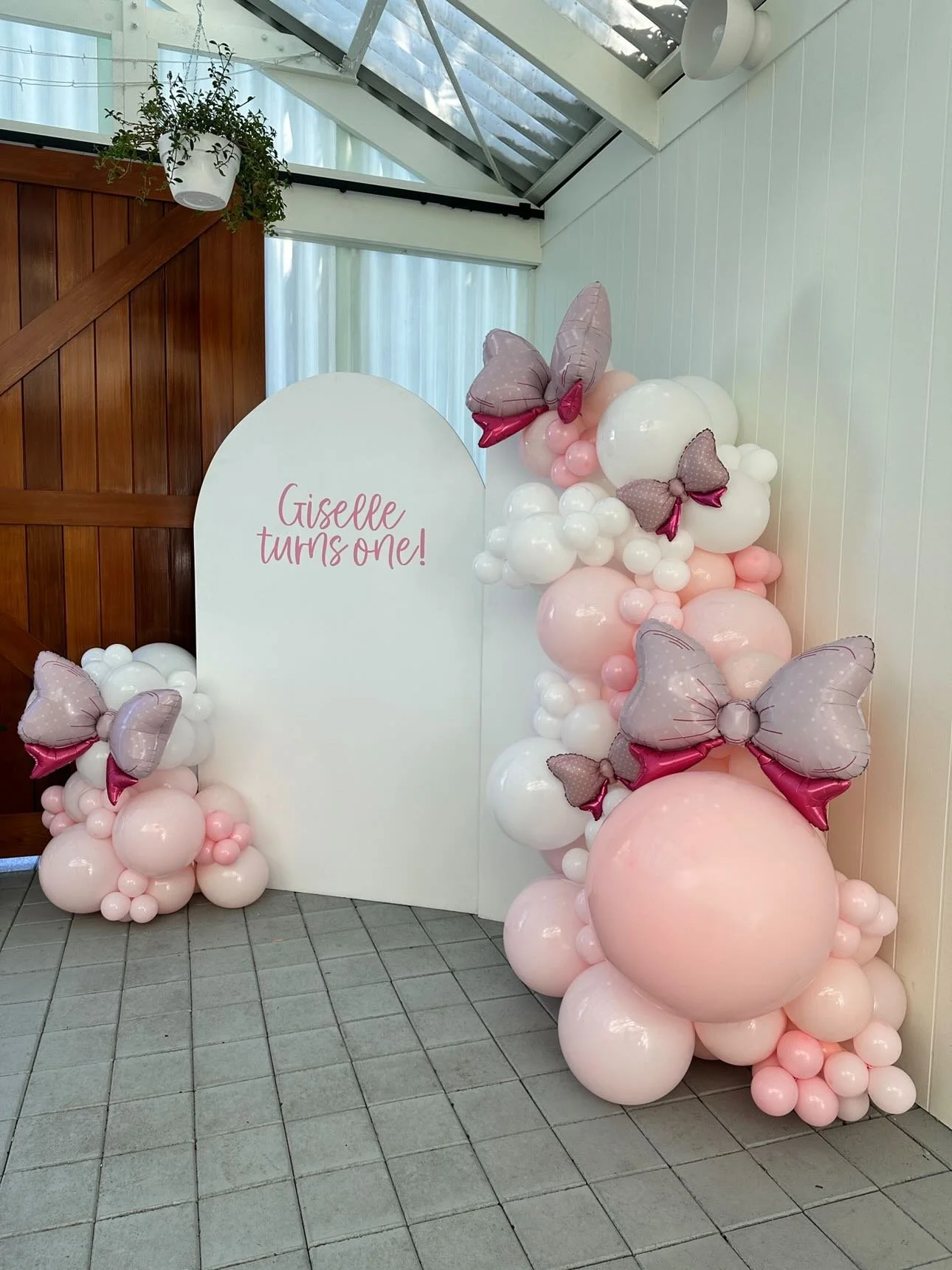 Arched Backdrops at Sublime Social, Clarence Park. Decals reading 'Giselle turns one' in Soft Pink by Nutmeg Creative. Balloons & Bows Balloons & More. Sublime Café & Catering, Adelaide.