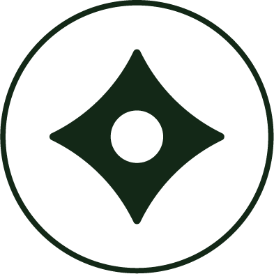 A black circular logo with a green diamond shape in the center and a small green circle inside the diamond.
