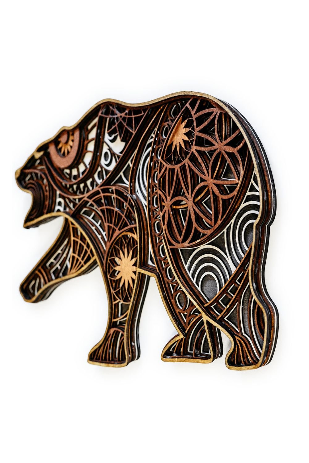 Side view of bear mandala wall art highlighting stacked wood layers and dimensional construction.