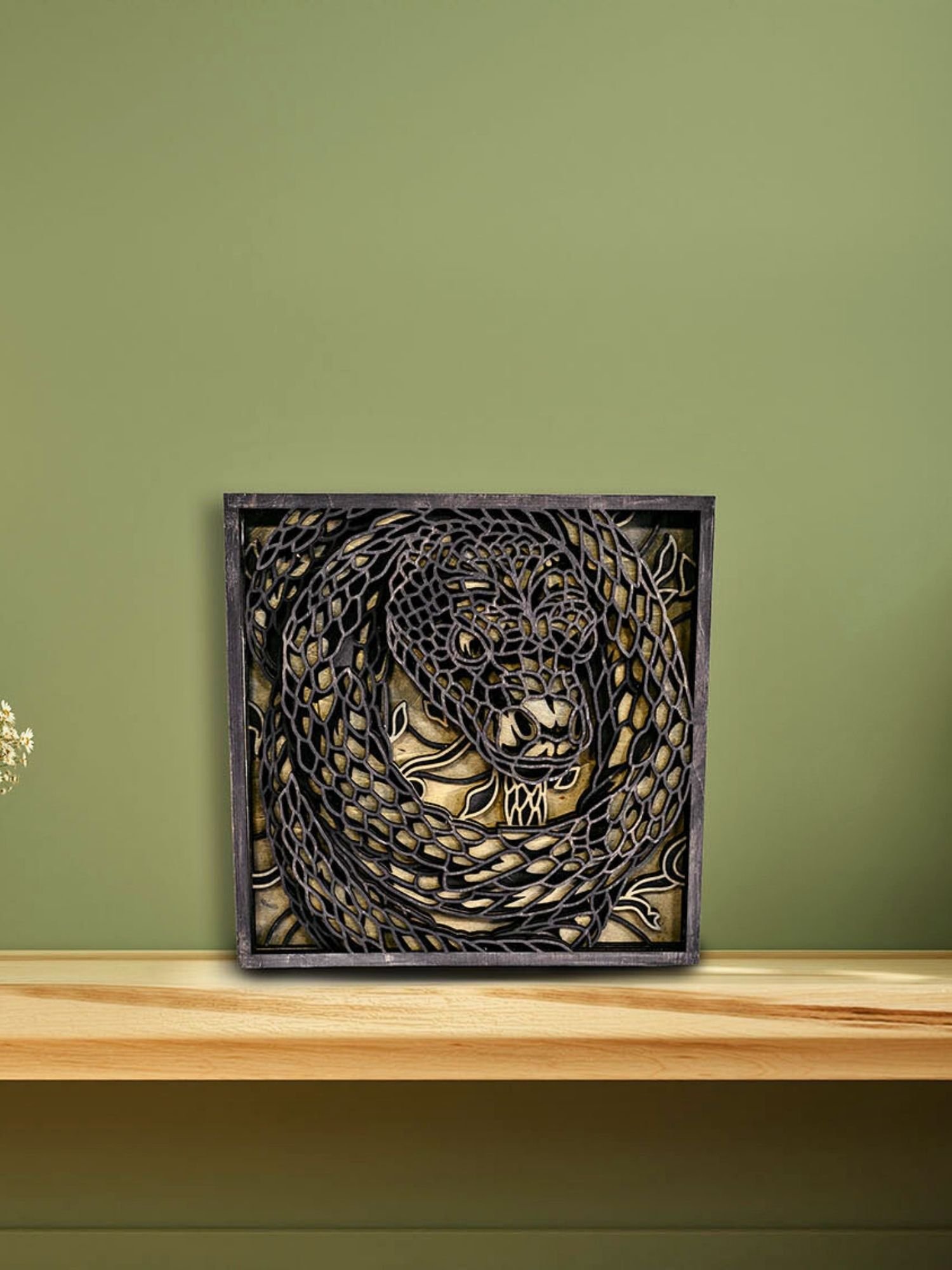 Laser cut snake wood wall art showing precise layered construction