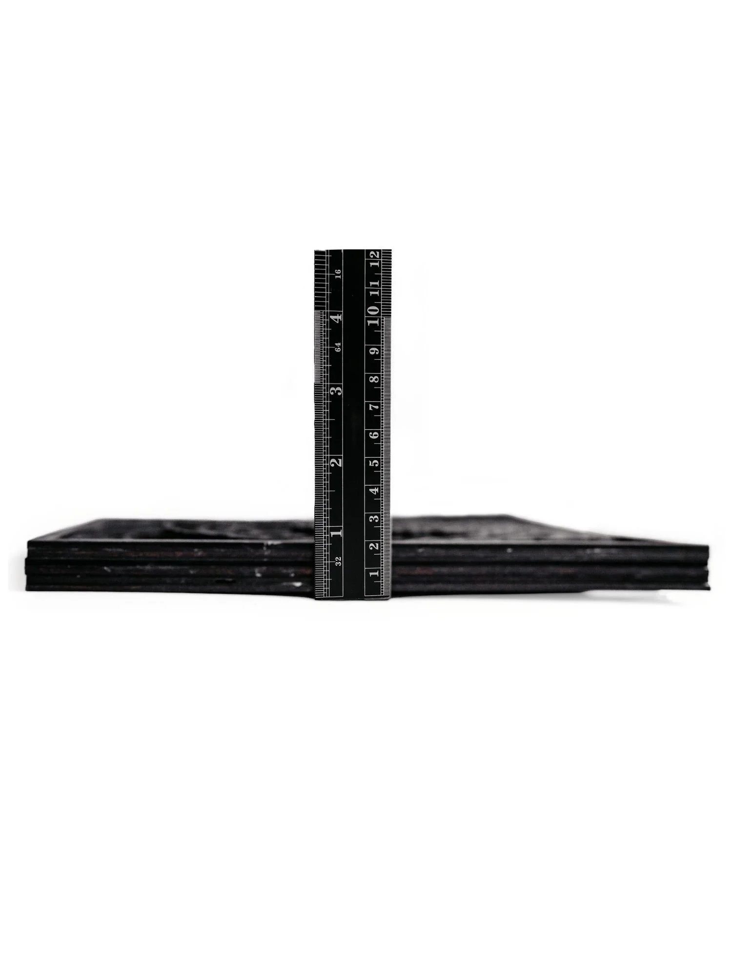 Side profile of layered snake wood wall art showing dimensional thickness