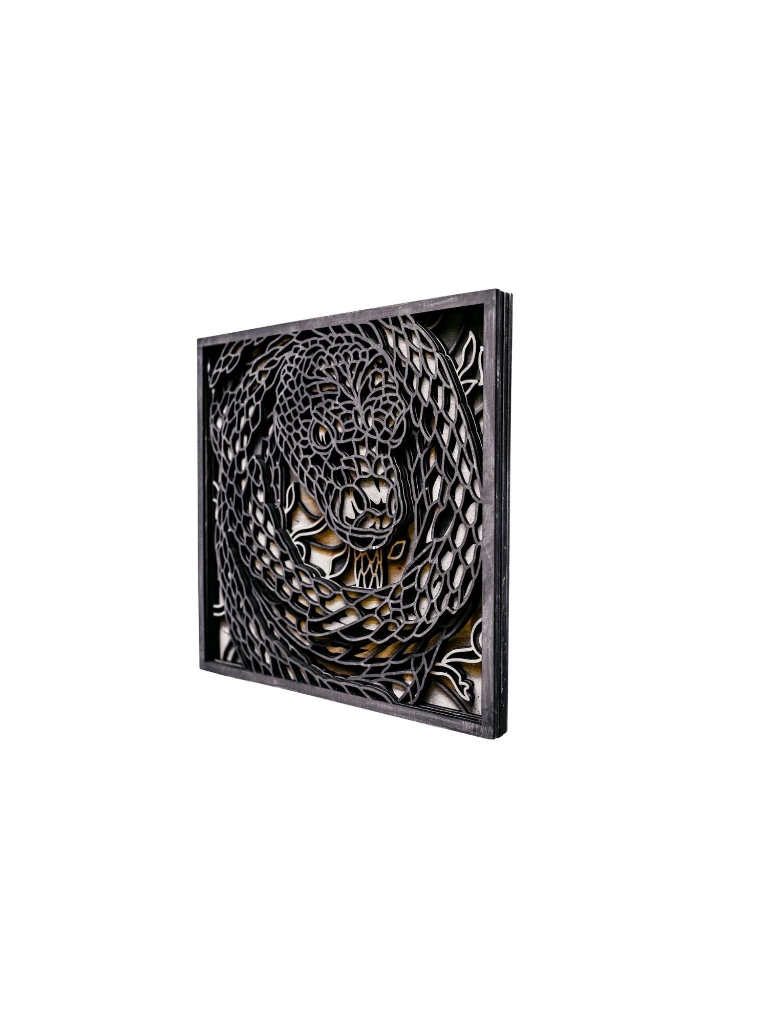 Angled view of snake layered wood wall art highlighting depth and stacked wood layers
