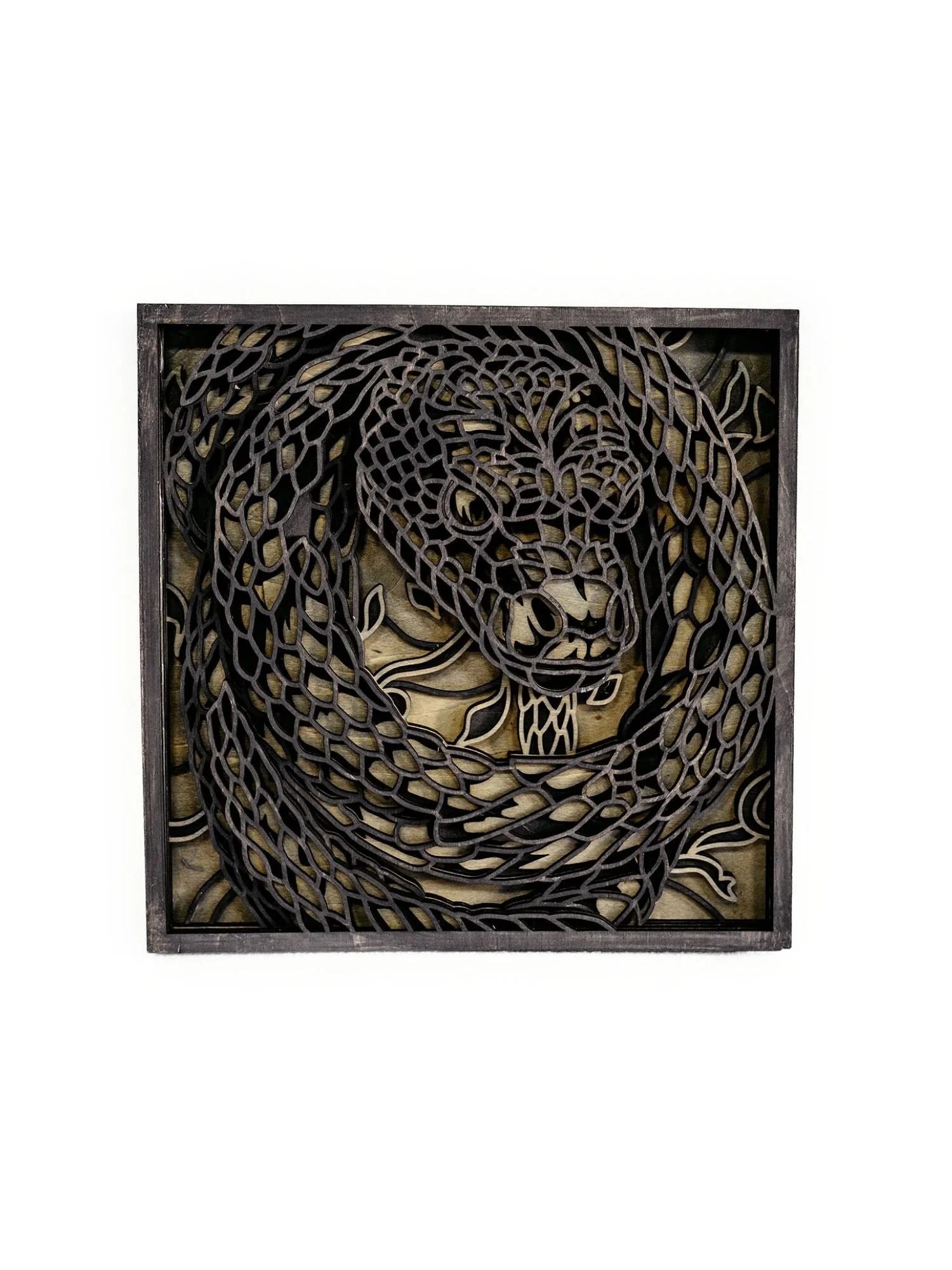 Layered snake wood wall art featuring a coiled snake design with laser cut wooden layers
