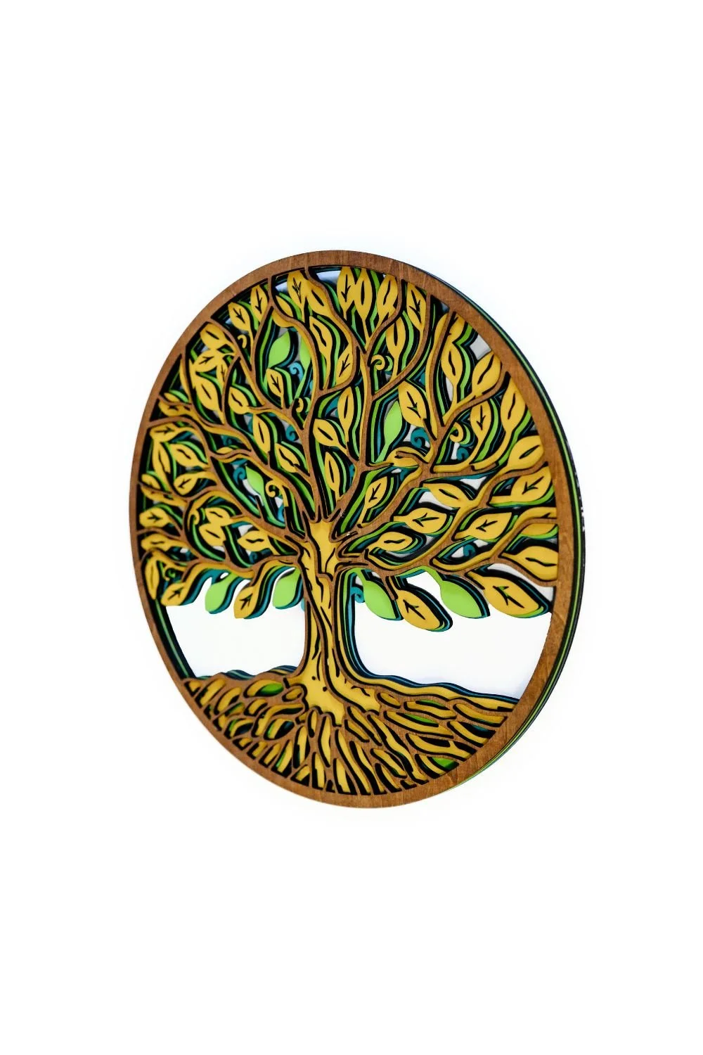 Angled view of Tree of Life wood wall decor highlighting layered depth and dimensional design
