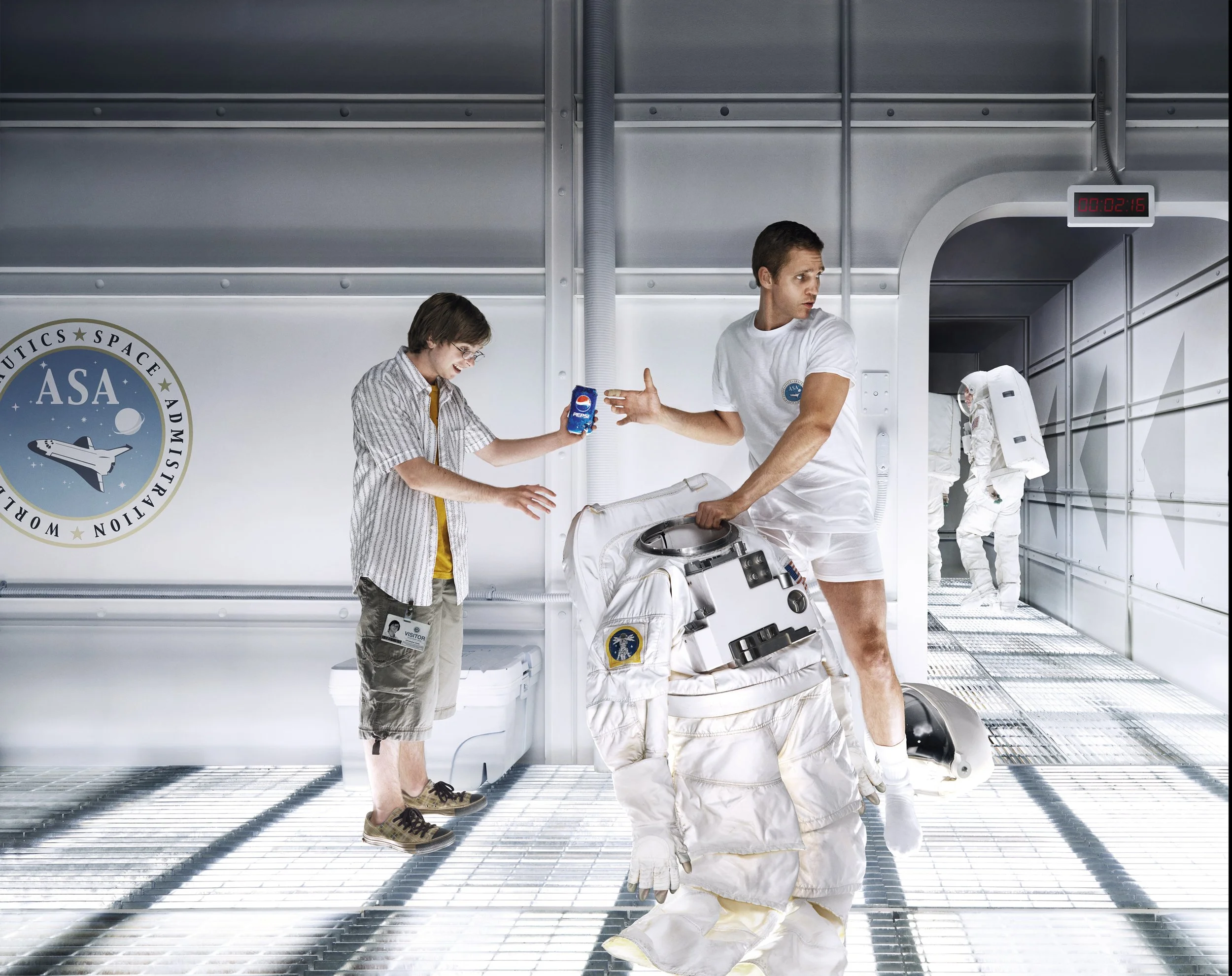 A humorous scene inside a spaceship with two astronauts and a young boy. The boy humorously receives a can of Pepsi from one astronaut, who is dressed in casual shorts and a t-shirt. The other astronaut, in a space suit, is in the background near the