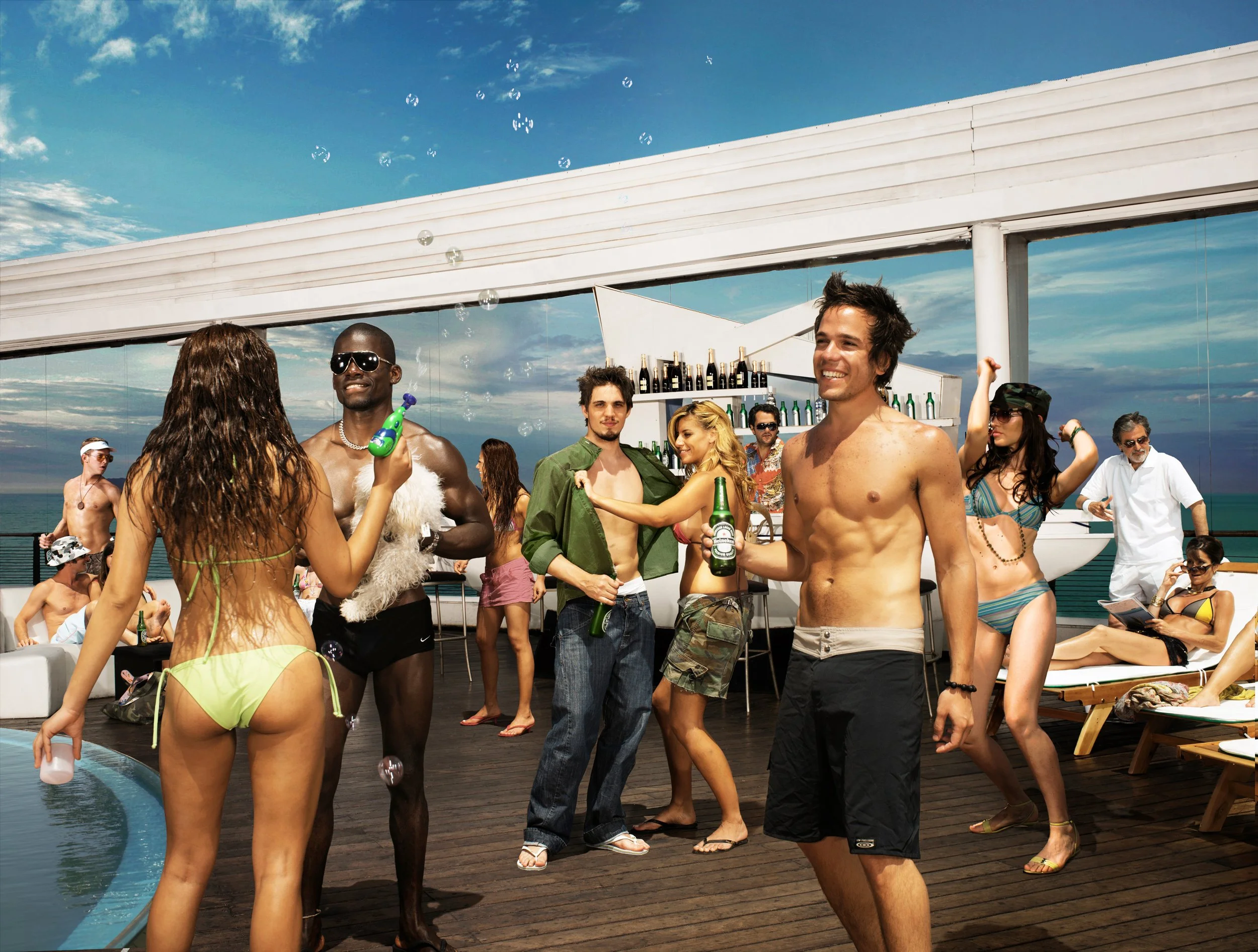 Group of young adults enjoying a poolside party on a rooftop, some dancing and chatting, with a bar, lounge chairs, and a pool in the scene.