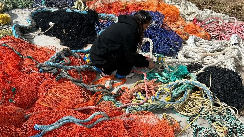 Collette Grey with sorting marine debris at Arts Ceduna. Photo by Mel Henderson, Ku Arts