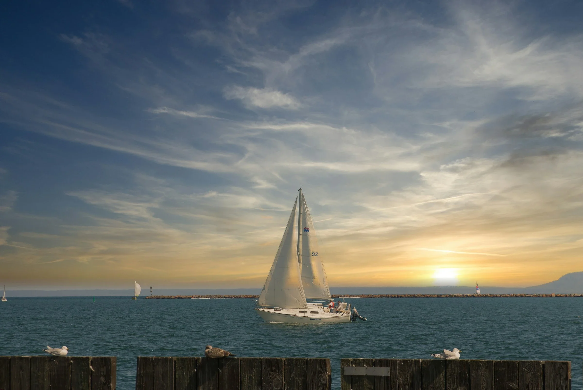 Sailboat sailing through Marina Park in Thunder Bay, ON.